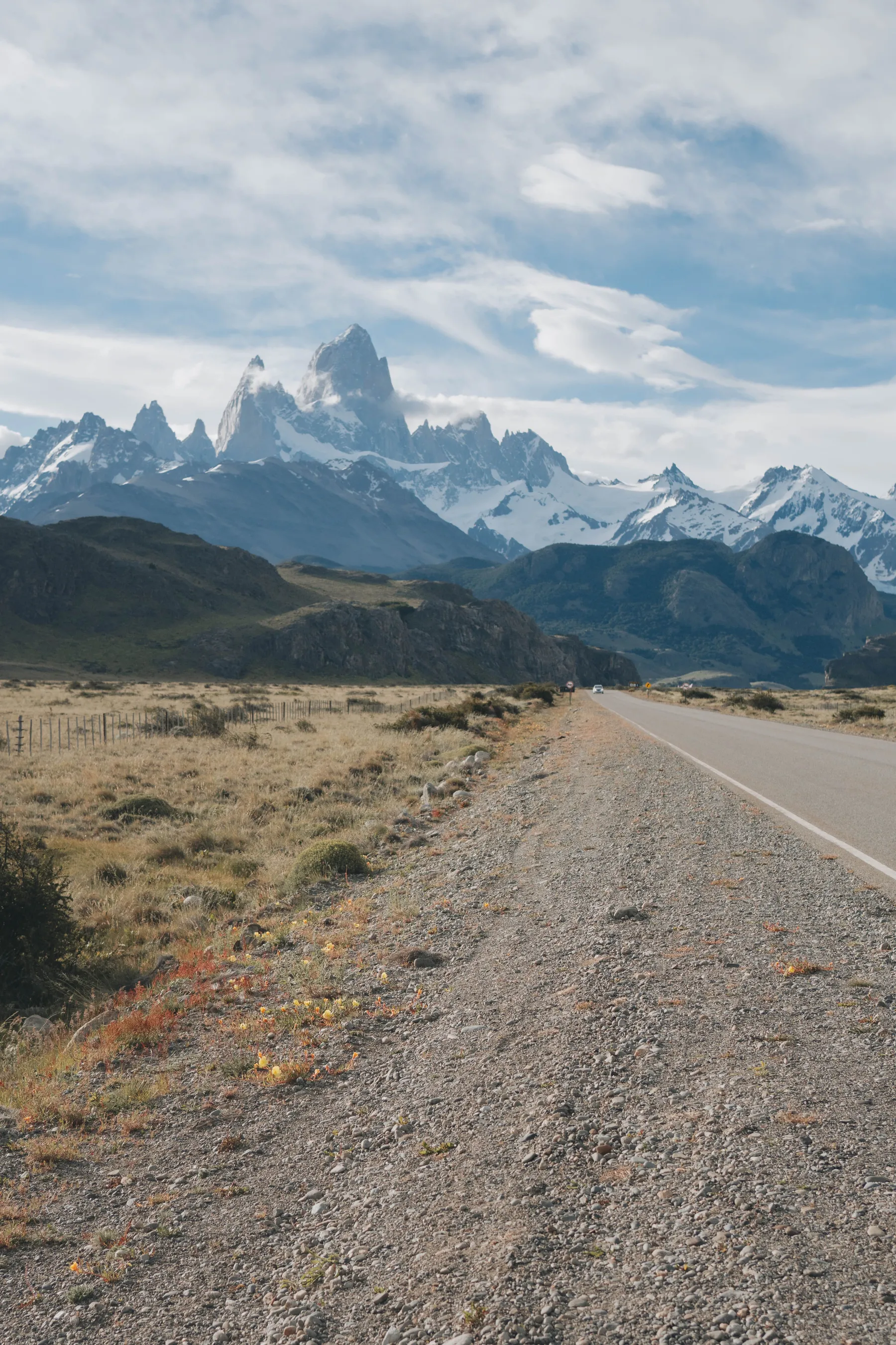 An open road leading towards snow-covered peaks near El Chaltén.