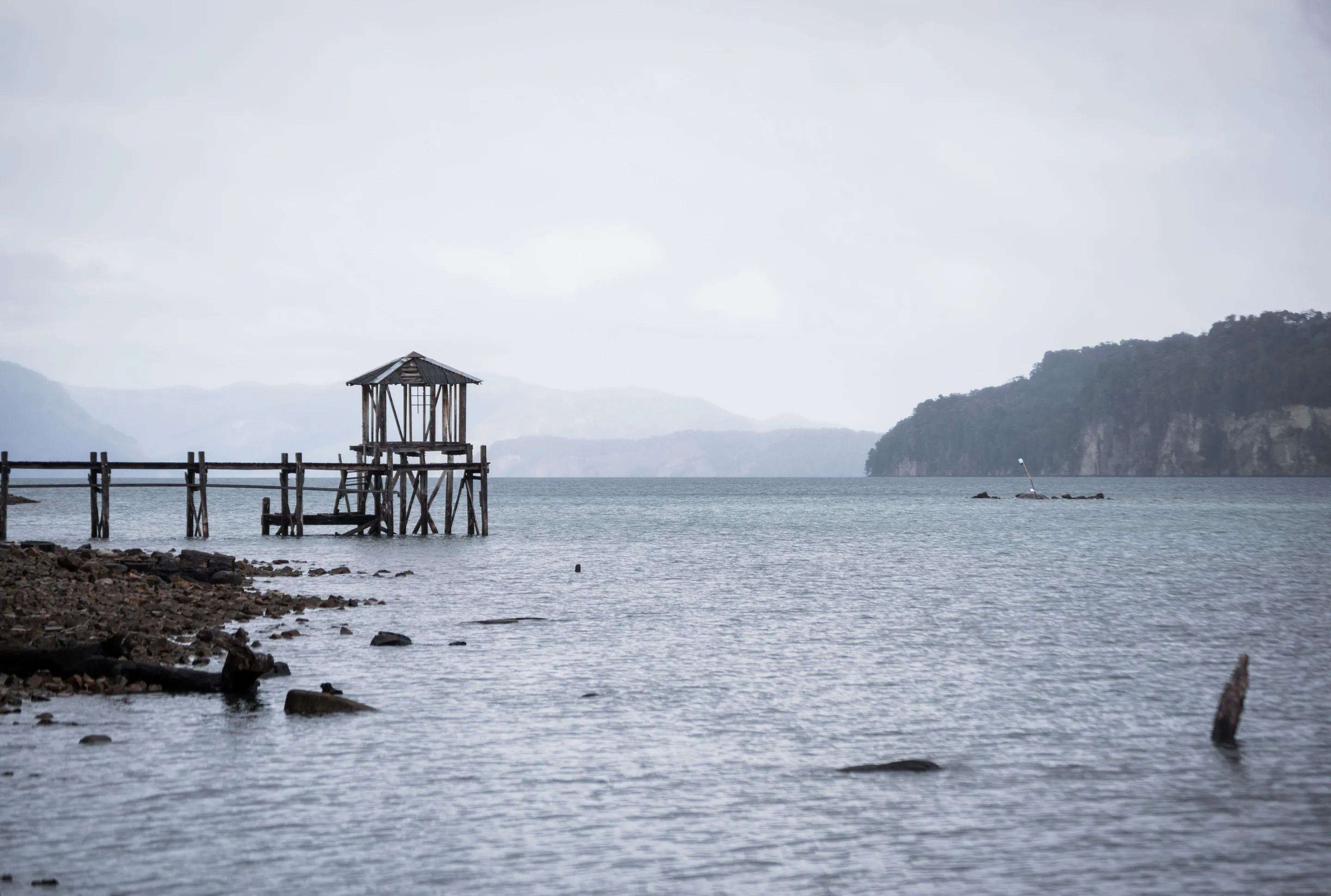 A wooden pier on the lakeshore at Villa La Angostura.