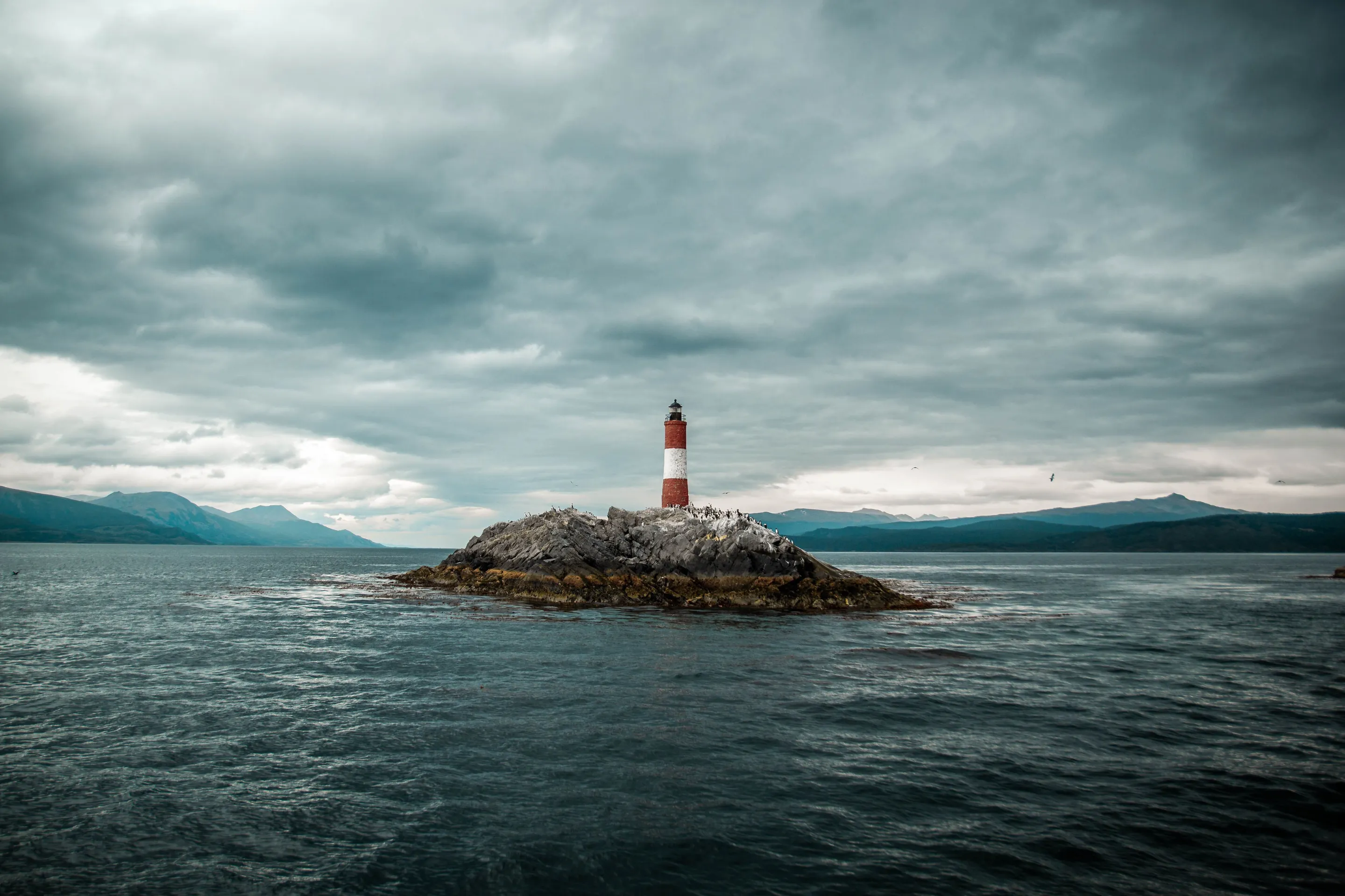 Les Éclaireurs lighthouse beneath a cloudy sky in the Beagle Channel