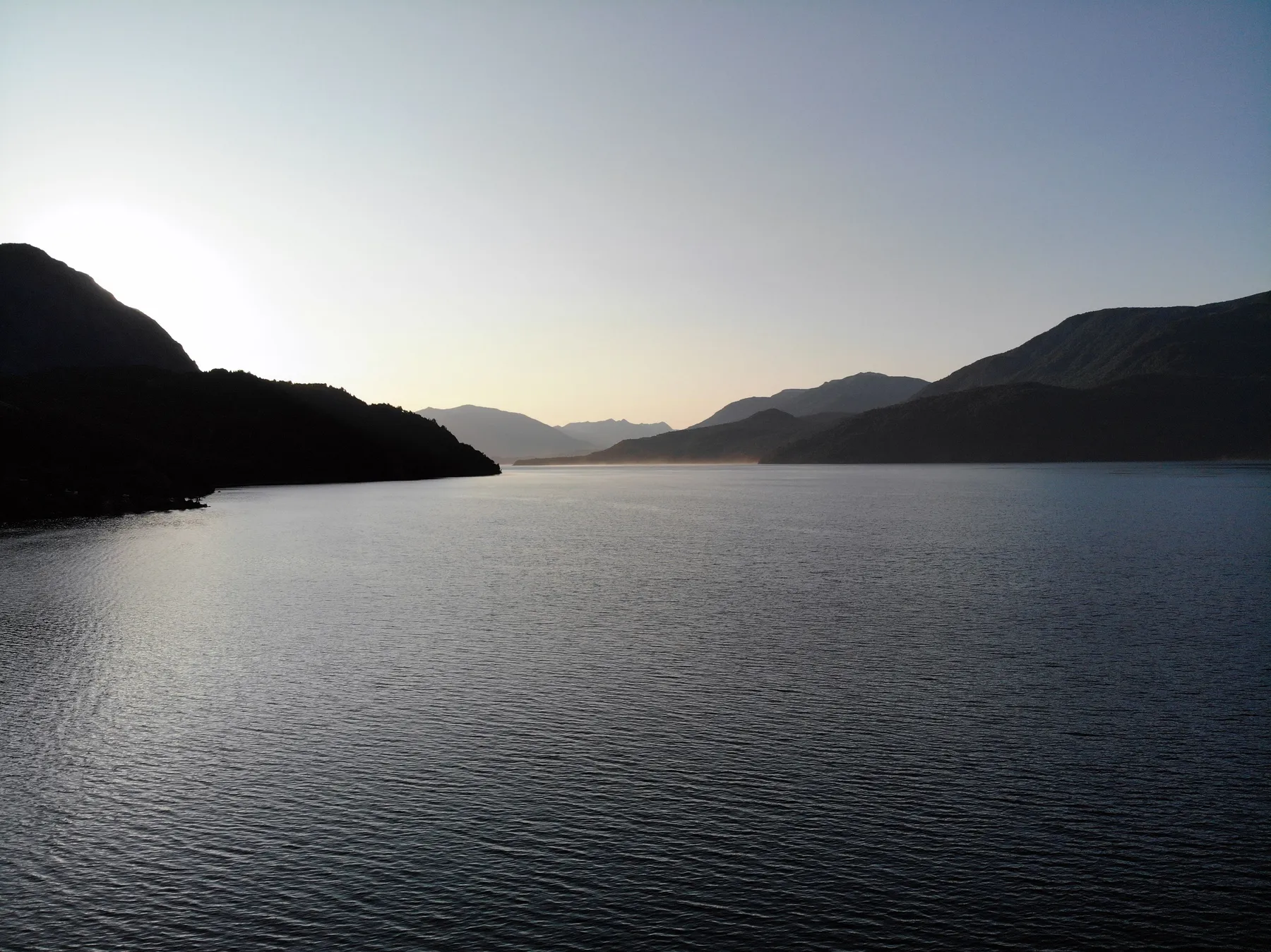 Morning light across a mountain-framed lake at San Martín de los Andes
