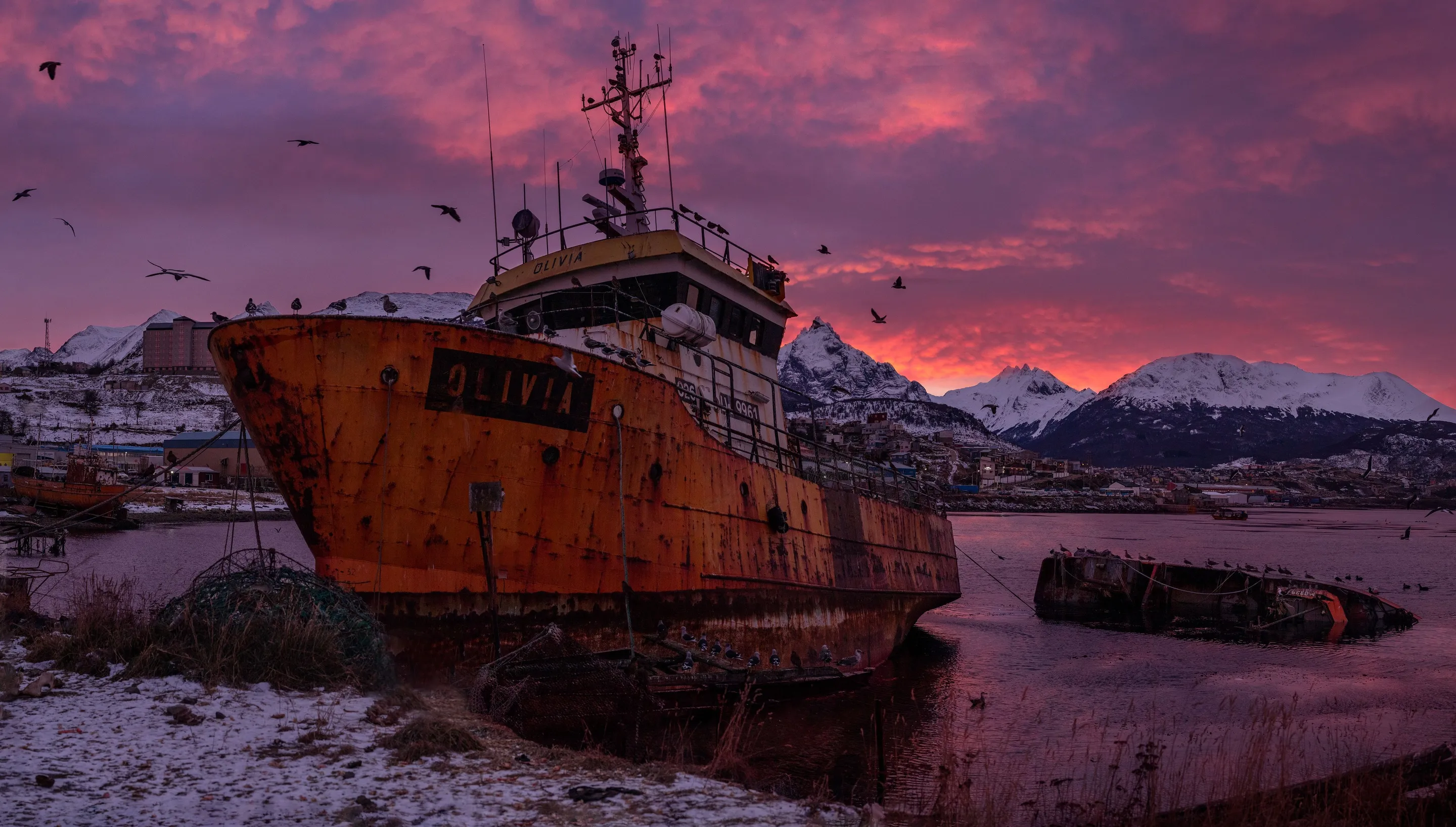 A ship on the Ushuaia shore in evening light.