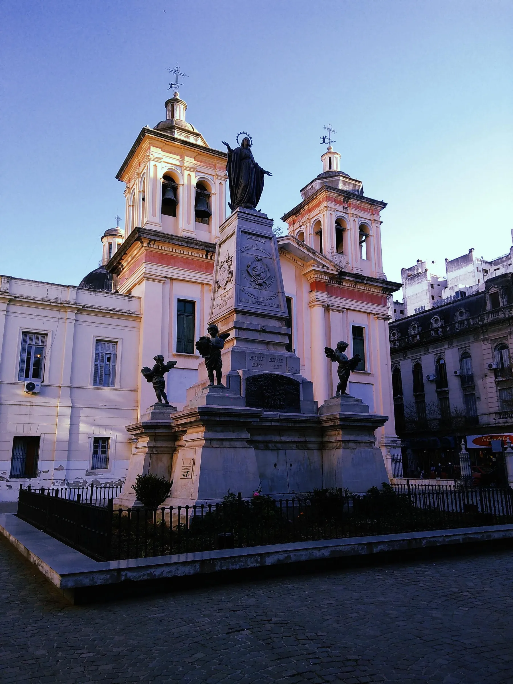 Historic church architecture and a monument in Córdoba