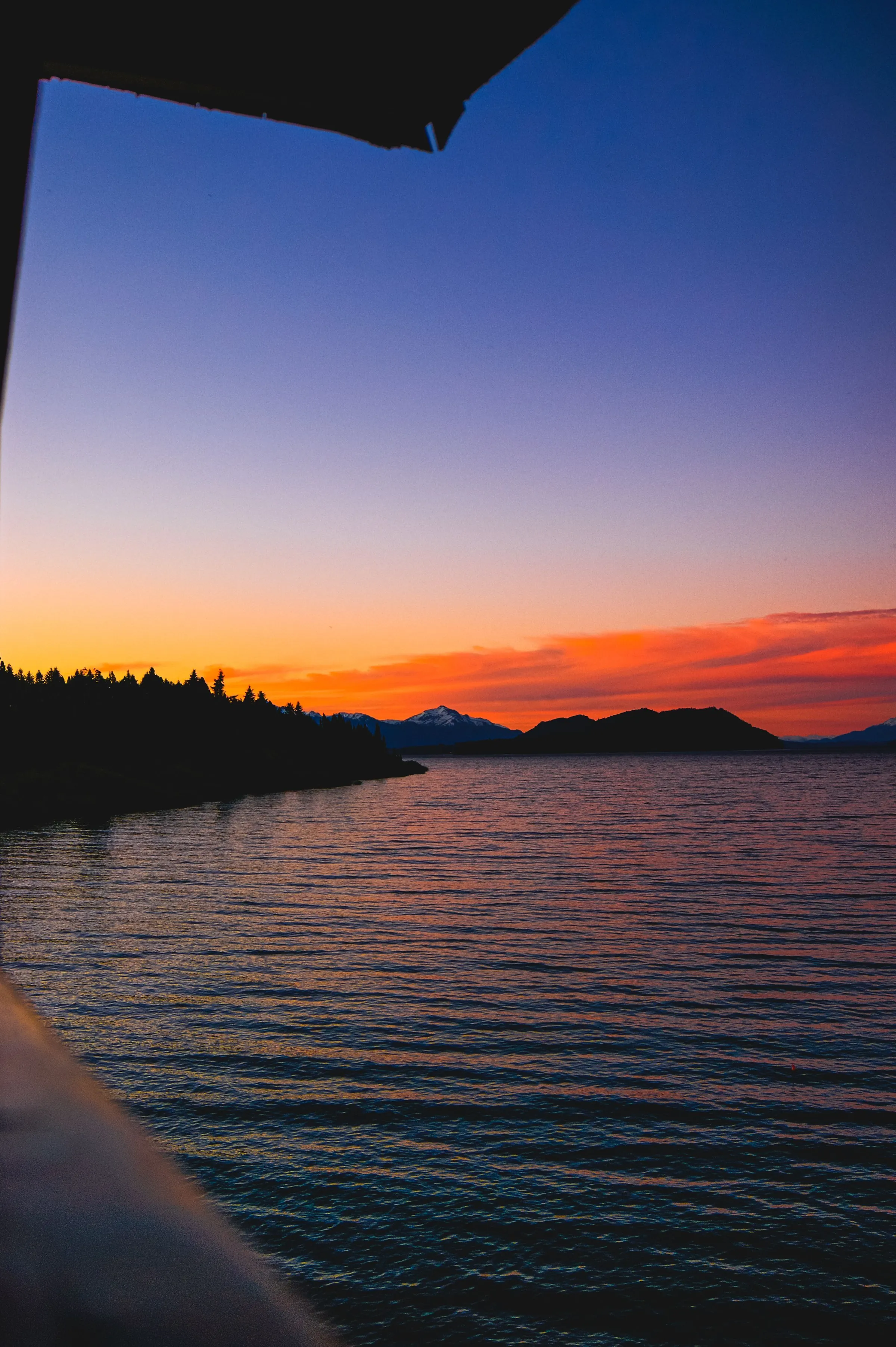 Colourful sunset over a mountain lake near Bariloche.