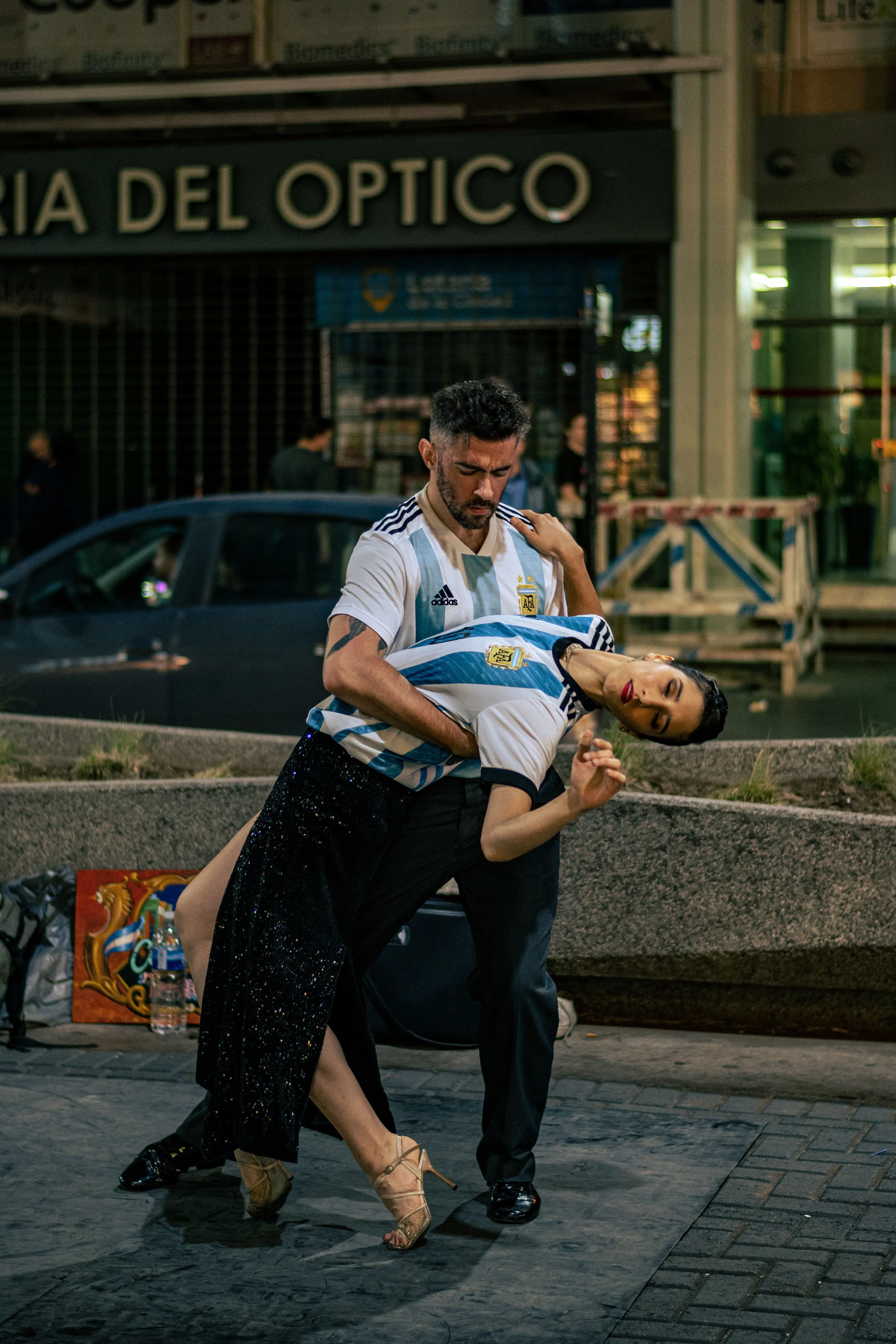 A couple performing tango on a Buenos Aires street.