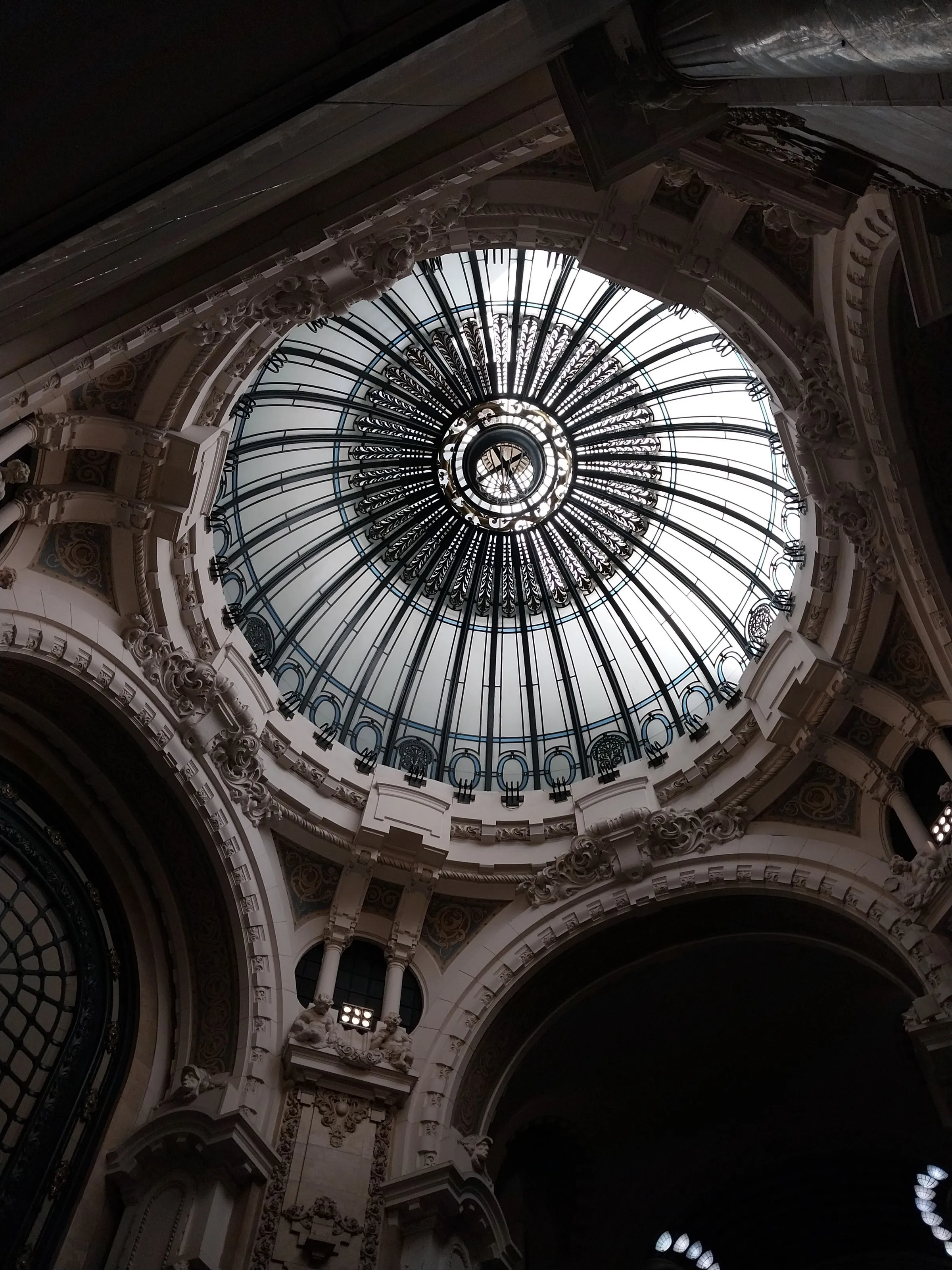 The glass dome and ornate interior of Galería Güemes, Buenos Aires.