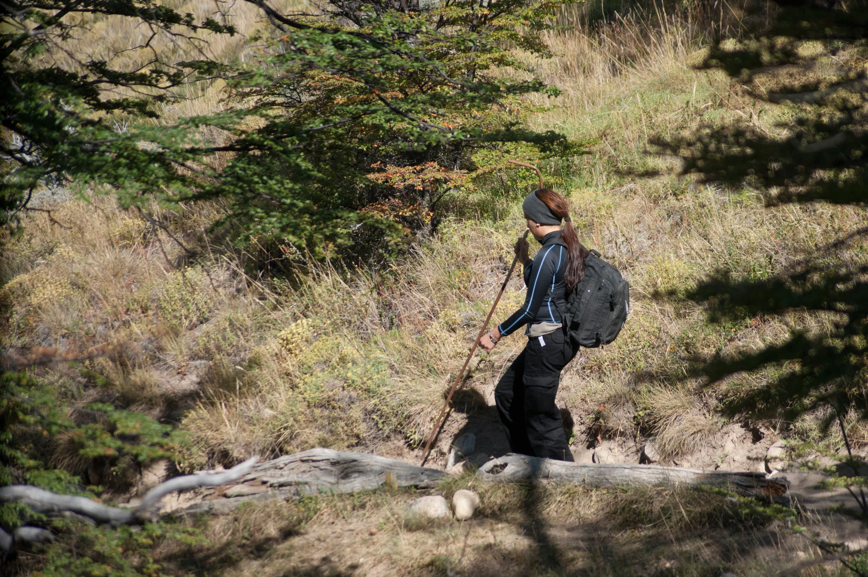 A backpacker descending a mountain path near El Chaltén.