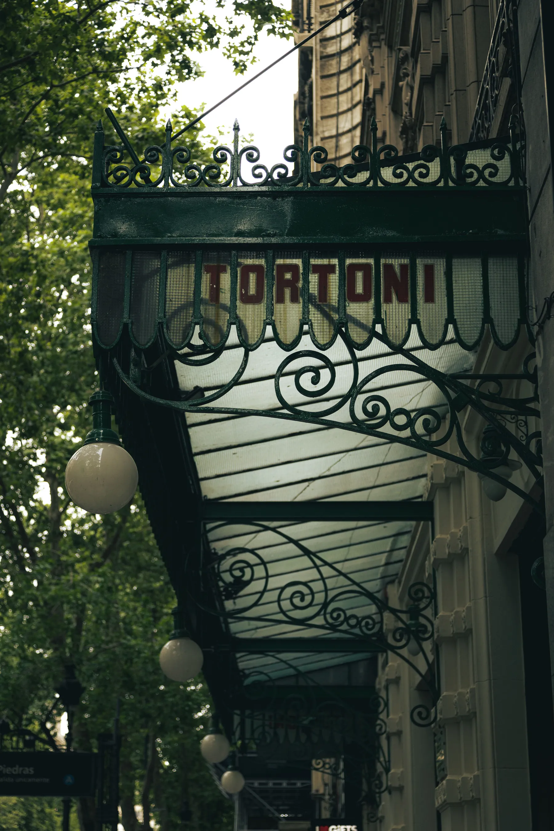 The historic Café Tortoni awning seen from below