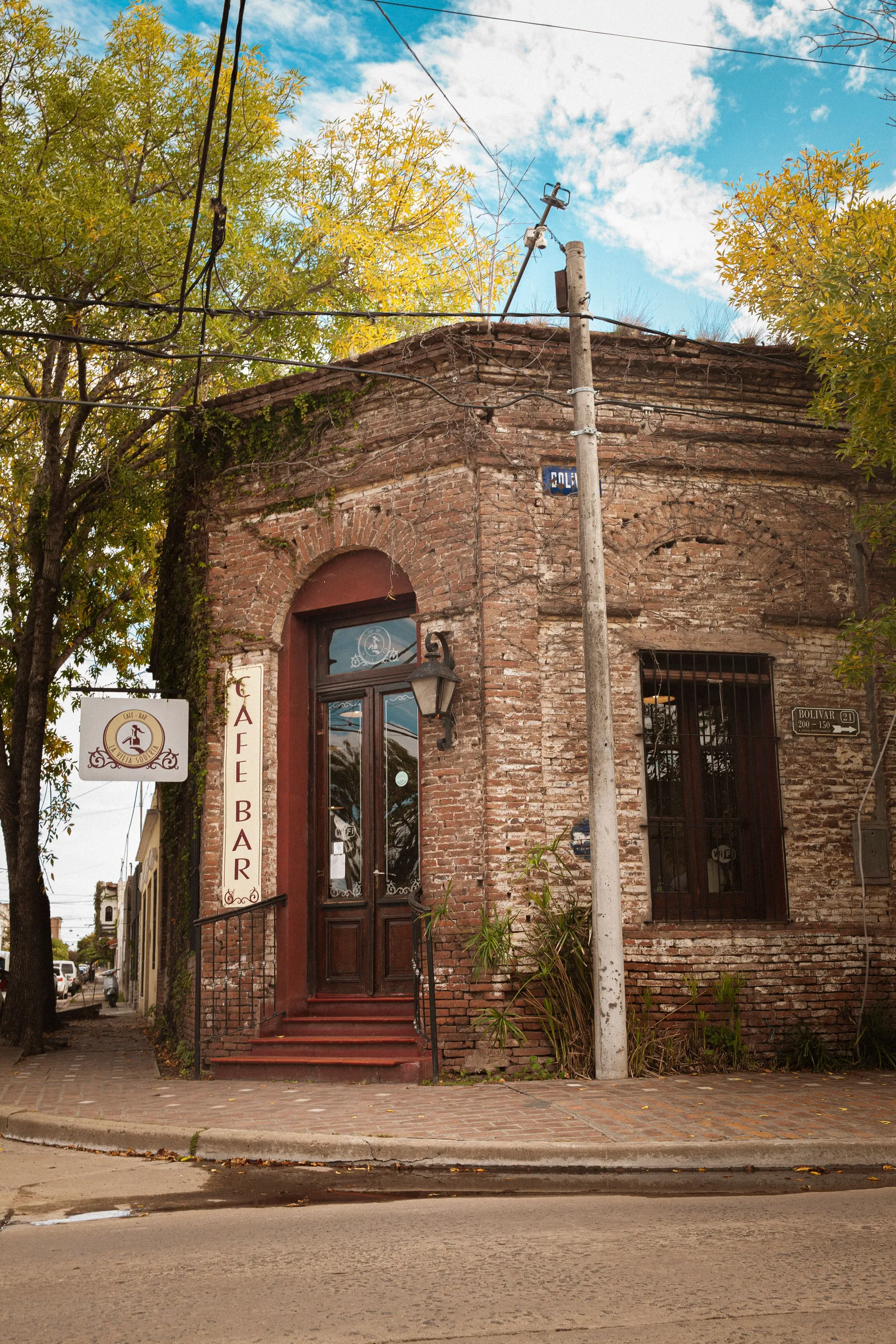 Autumn foliage and brickwork around an Areco café entrance