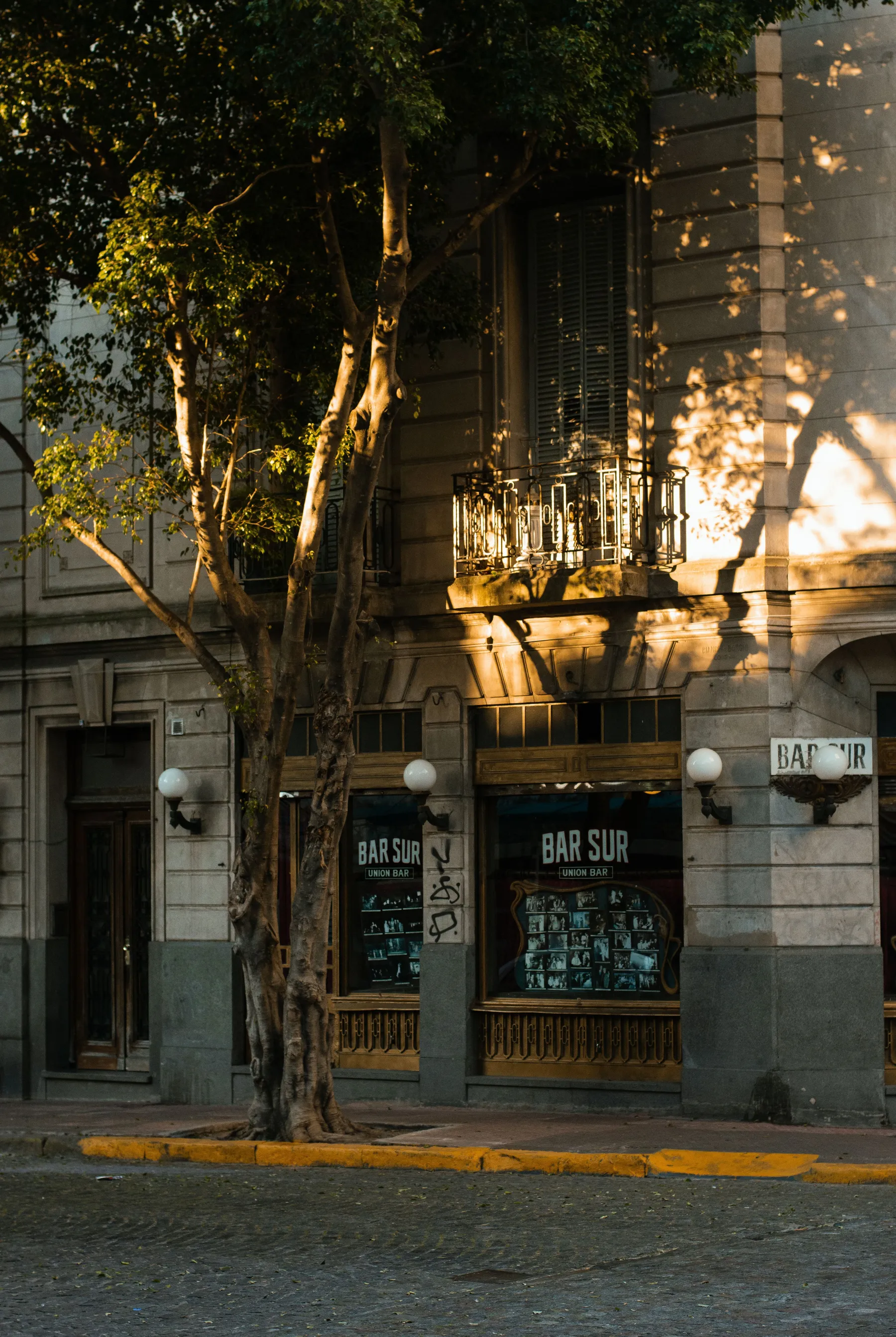 Warm sunlight on the historic Bar Sur facade in Buenos Aires.