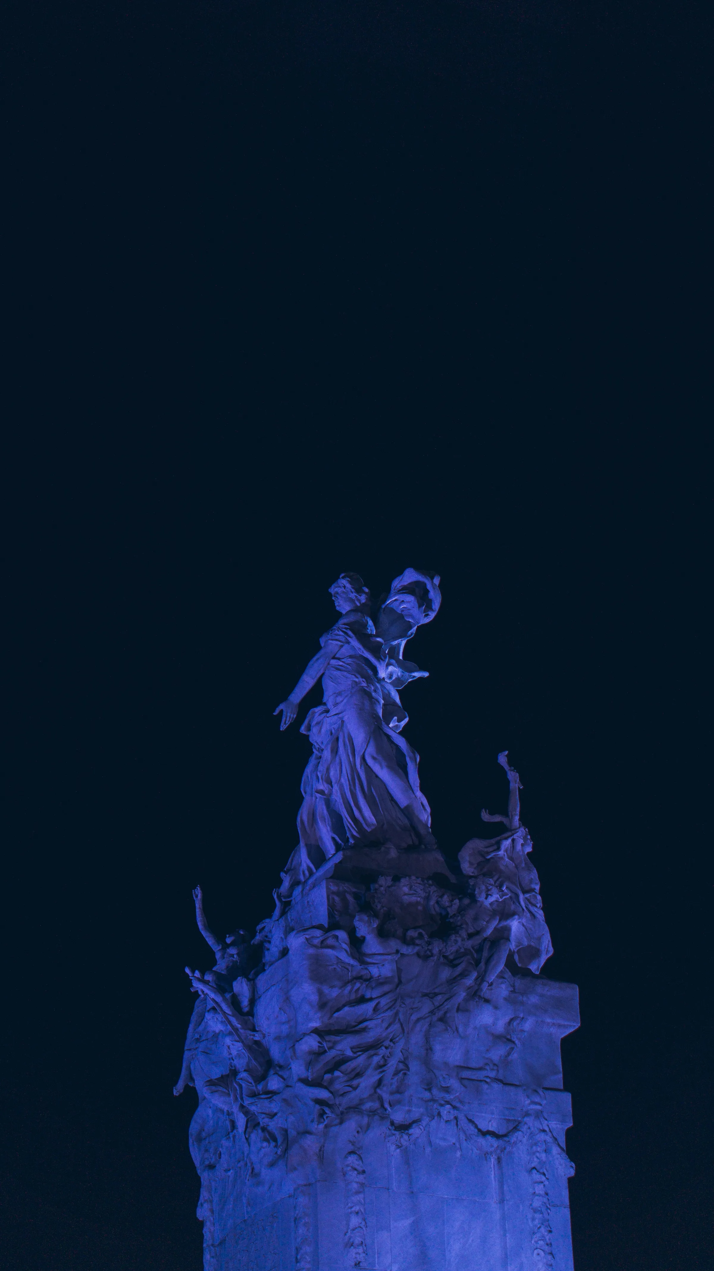 An illuminated sculpture in blue light in Buenos Aires.