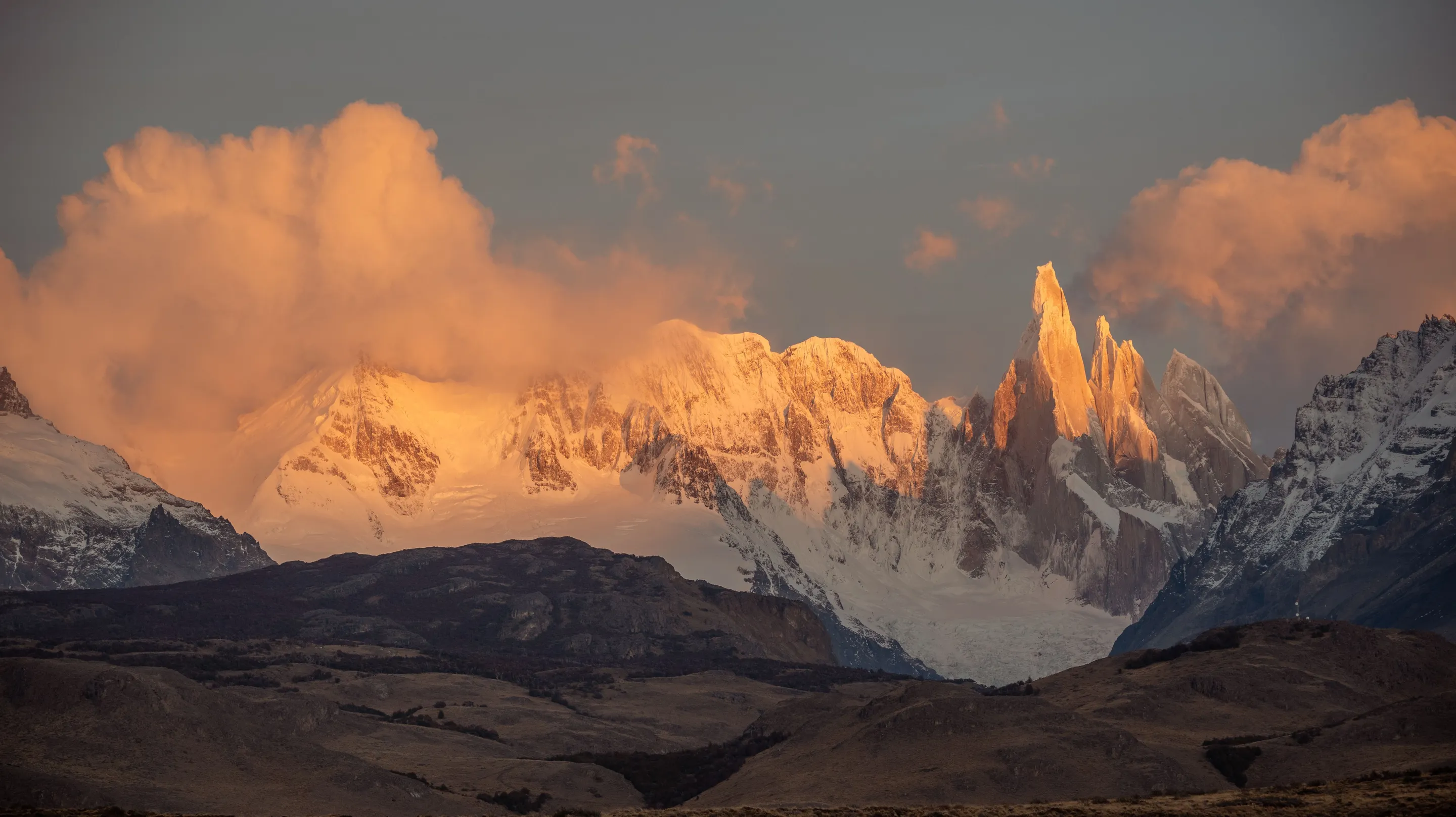 Dawn light touching the snowy mountain skyline near El Chaltén