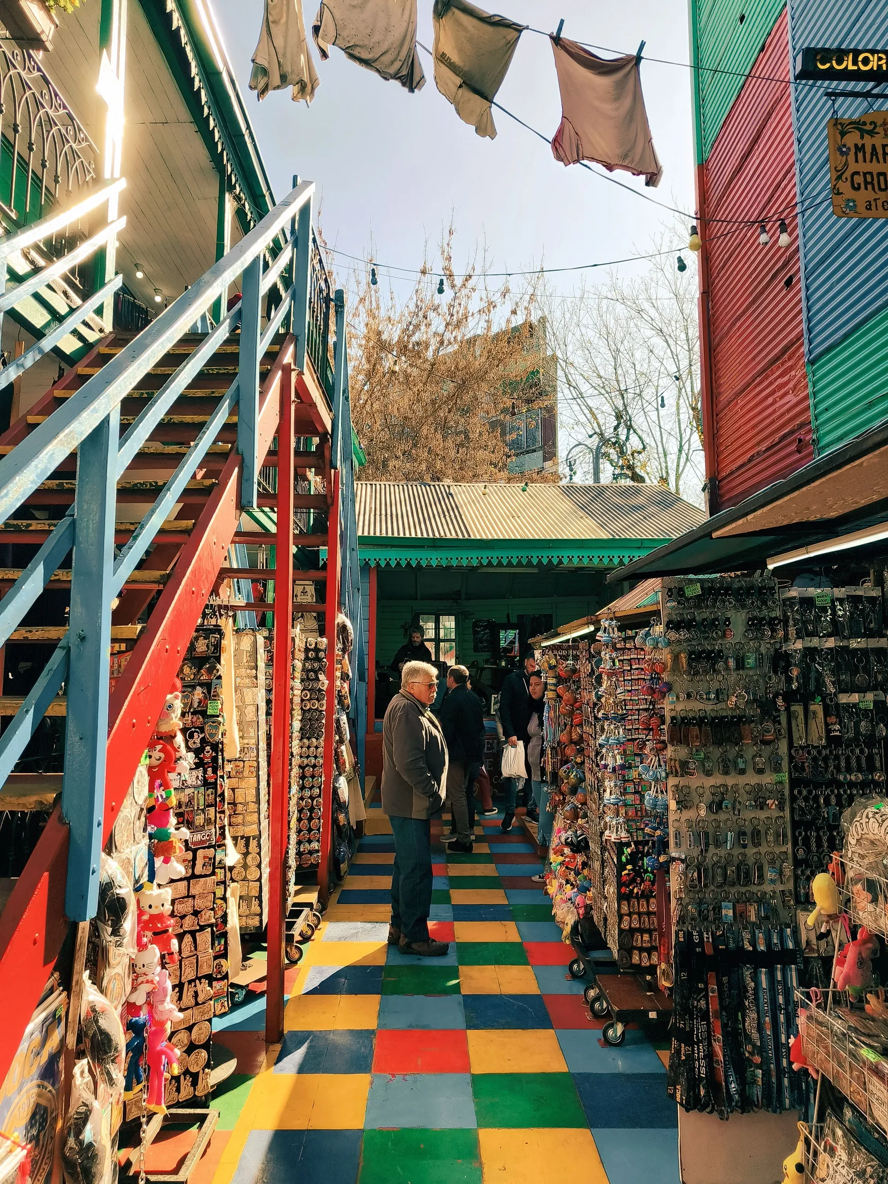 Colourful market stalls and visitors in Buenos Aires.