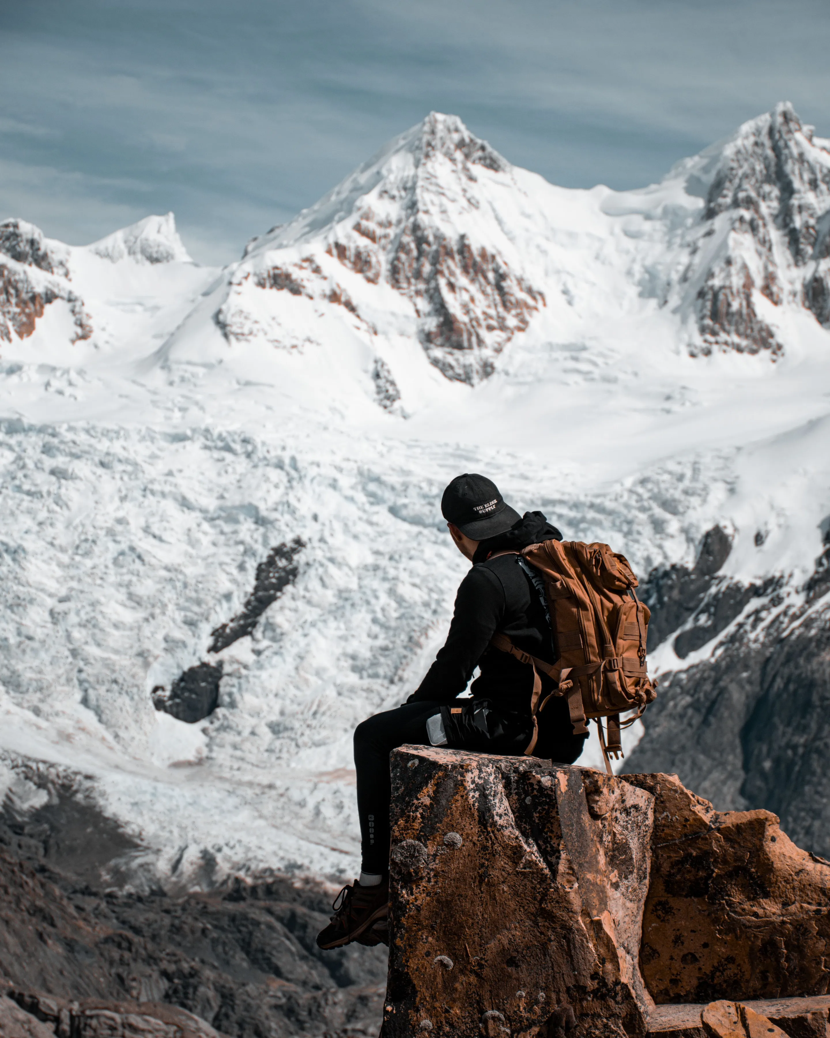 A backpacker pausing above the mountain scenery near El Chaltén.