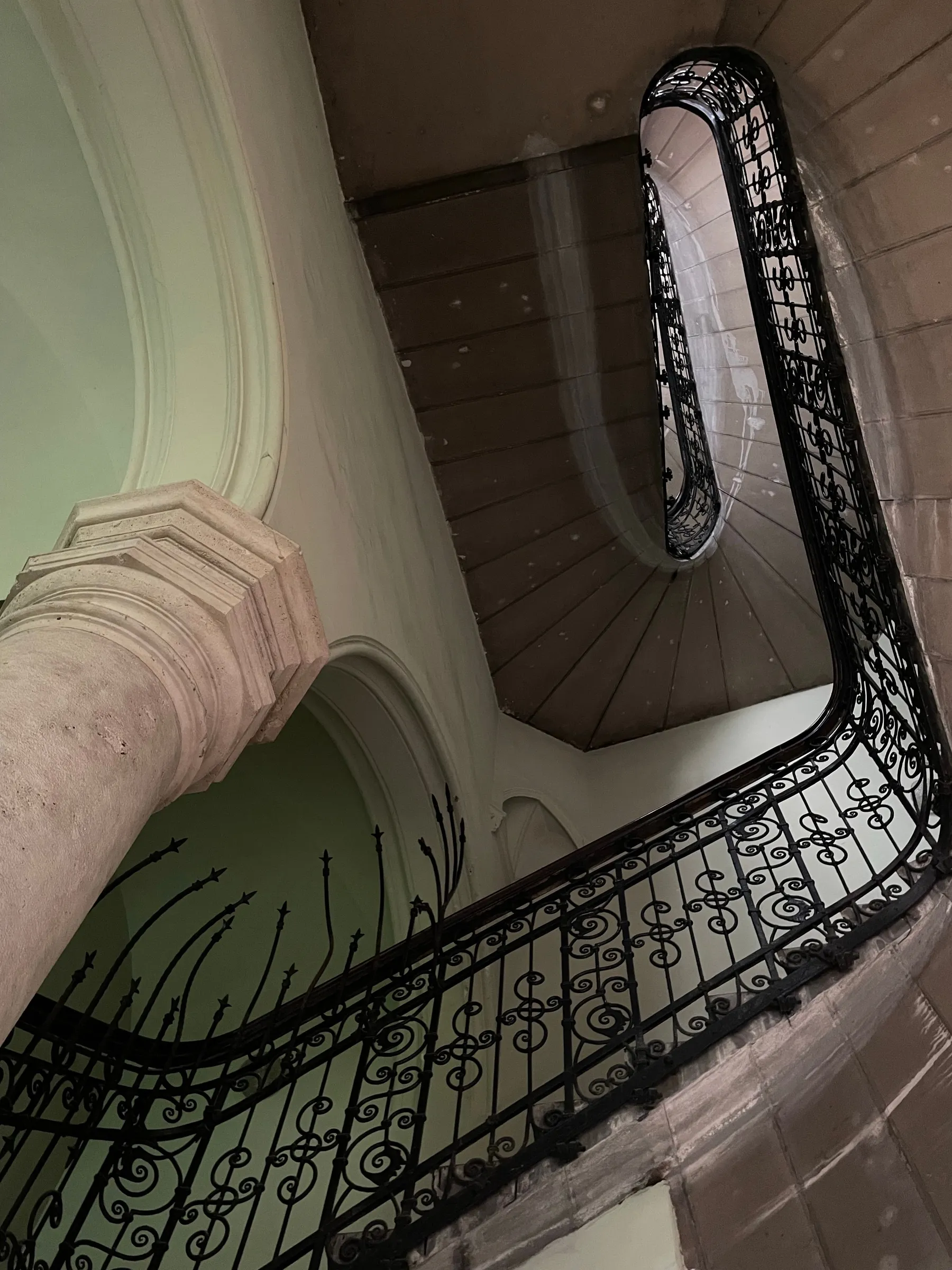 Sweeping stairwell and decorative ironwork inside Palacio Barolo