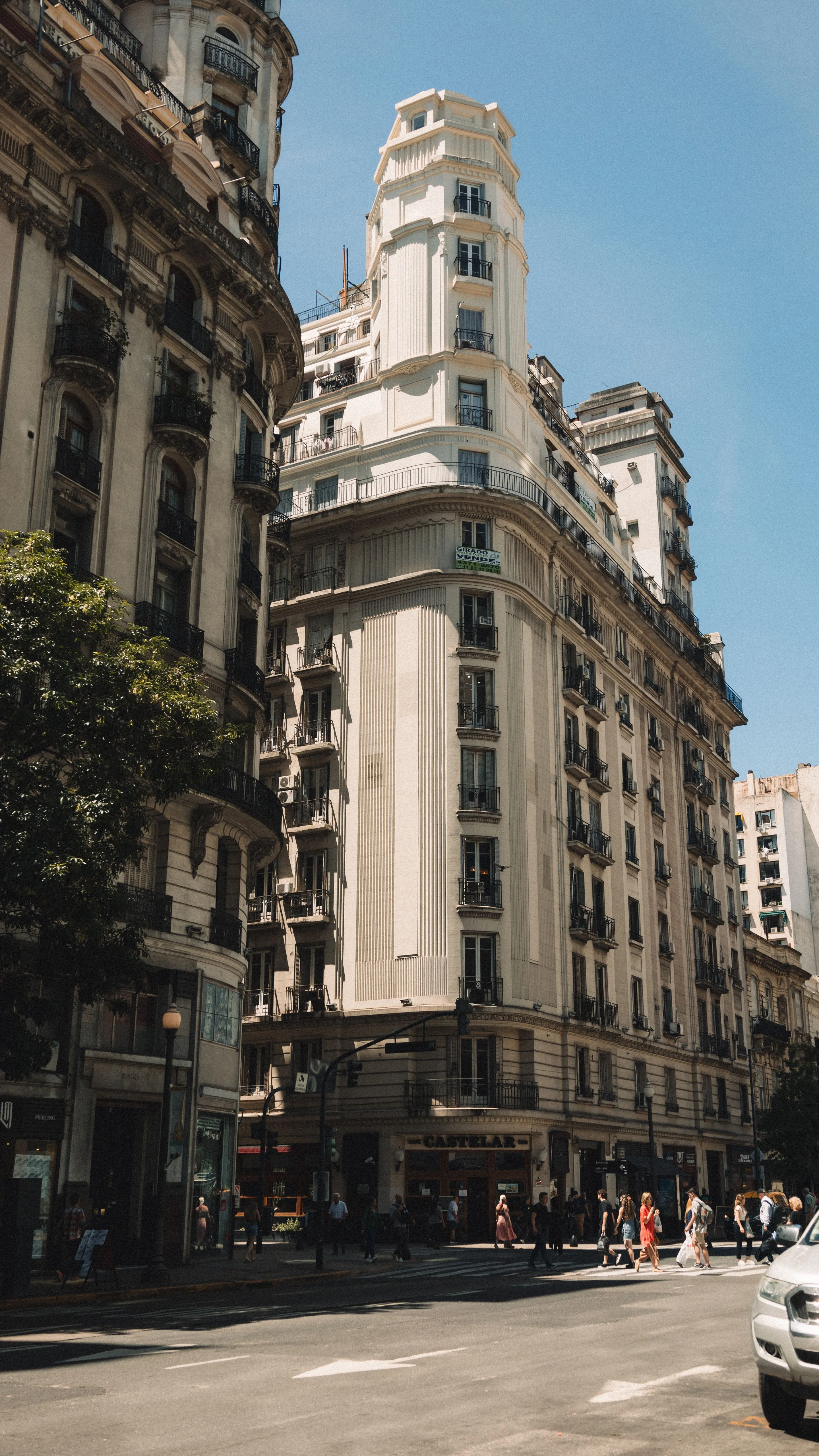 Ornate historic corner building above a Buenos Aires street