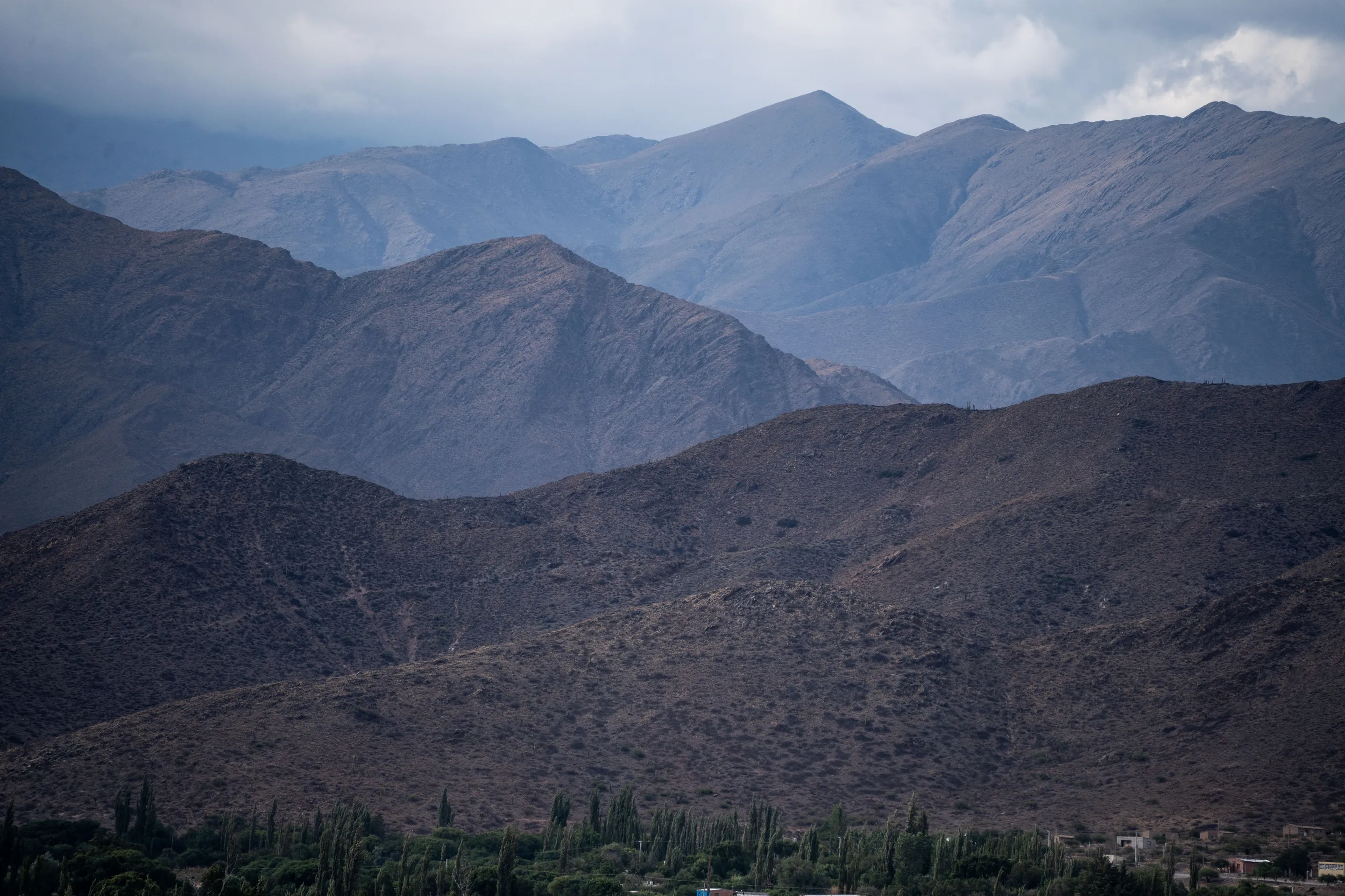 Layered mountain slopes and open country near Cachi