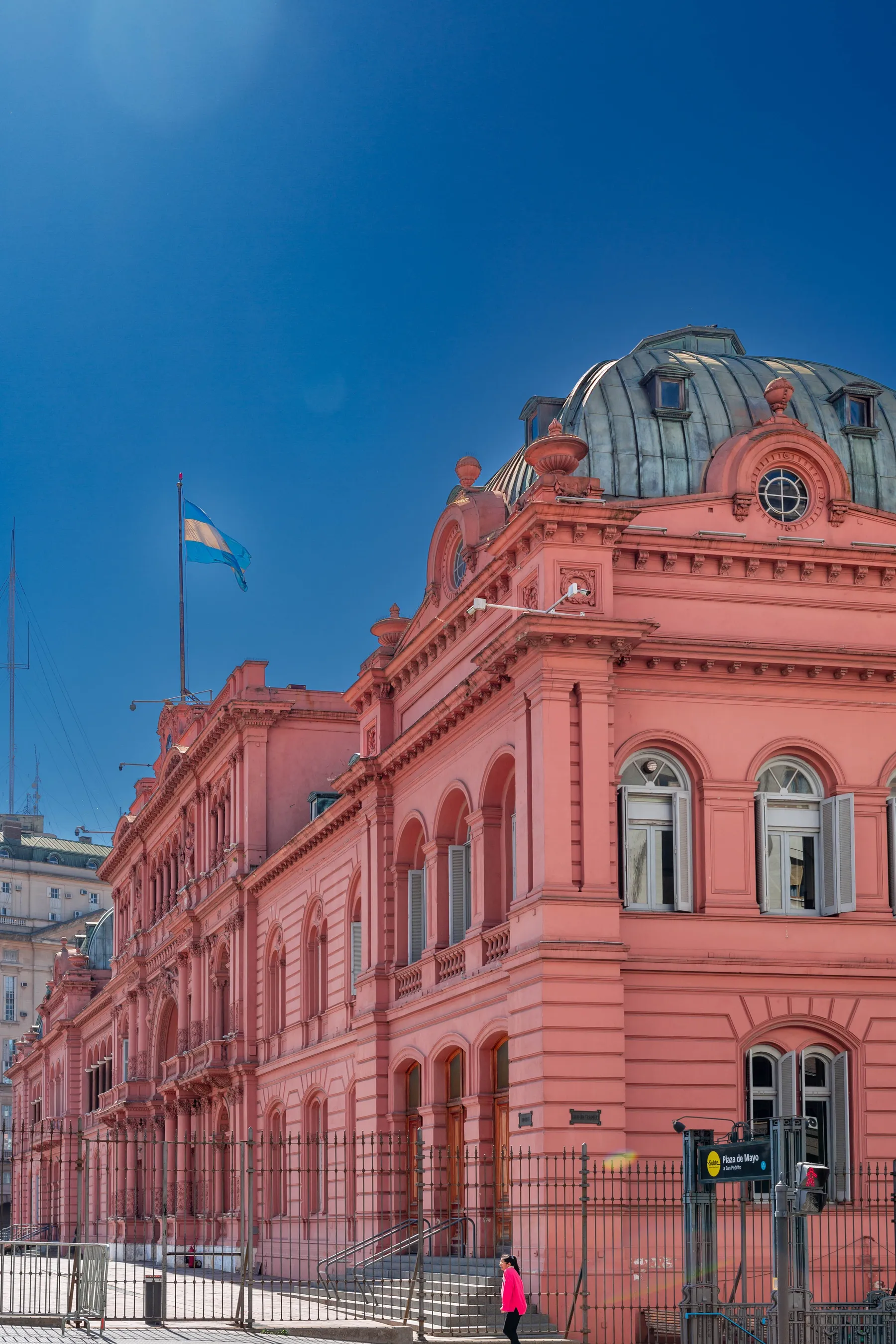 Casa Rosada's pink façade beneath a blue Buenos Aires sky.