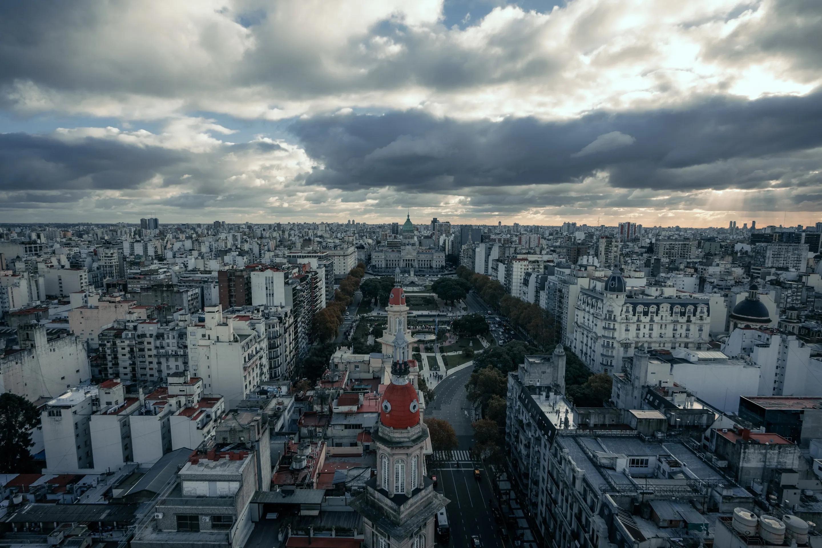 Historic architecture and the Buenos Aires cityscape beneath dramatic clouds