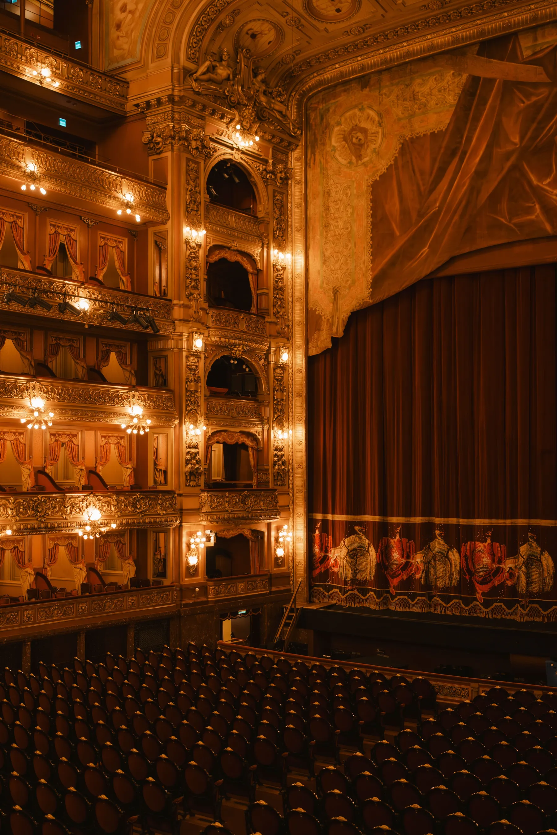 The warm light and ornate balconies of Teatro Colón.