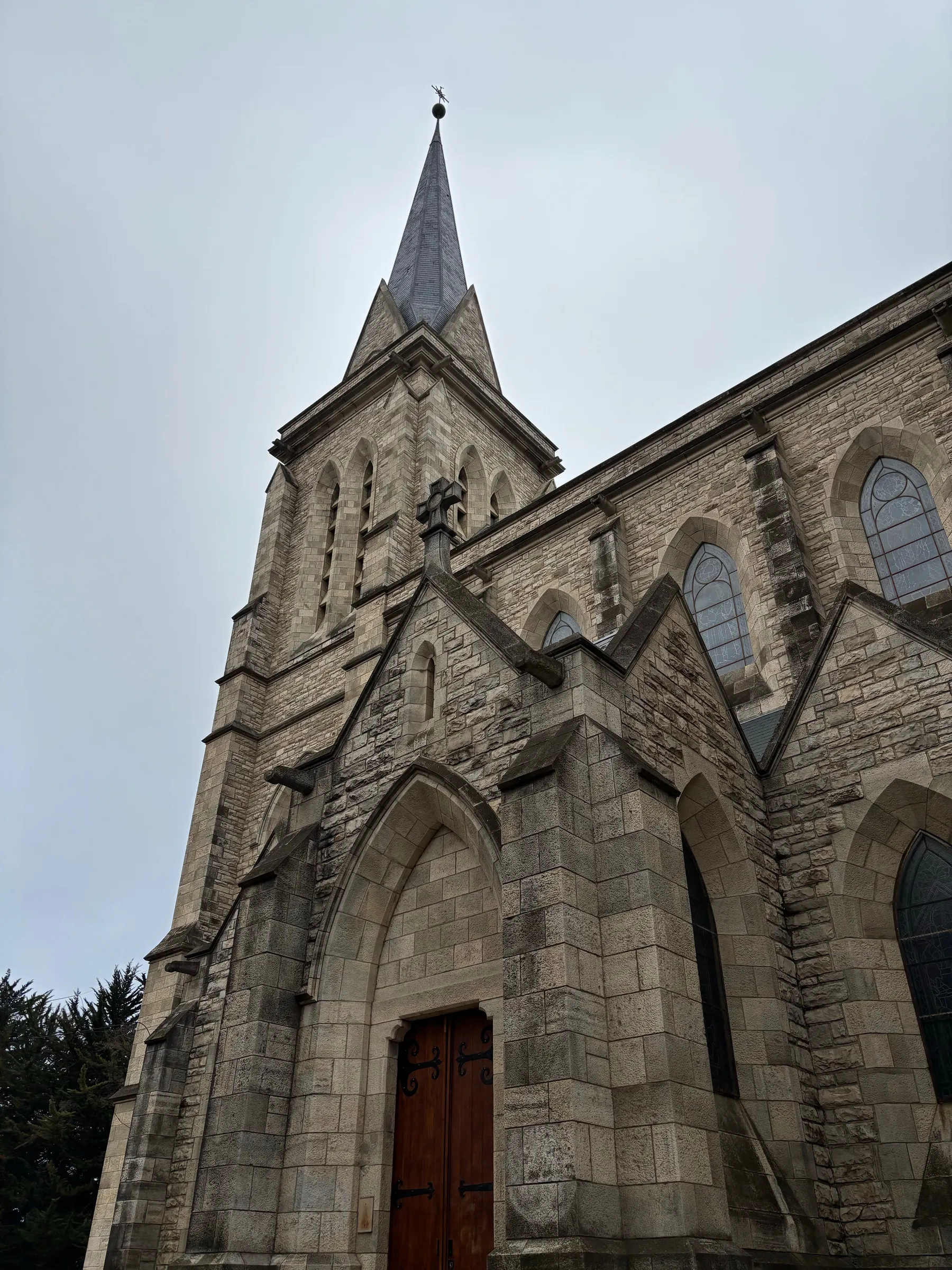 Stone arches and tower of Bariloche's cathedral
