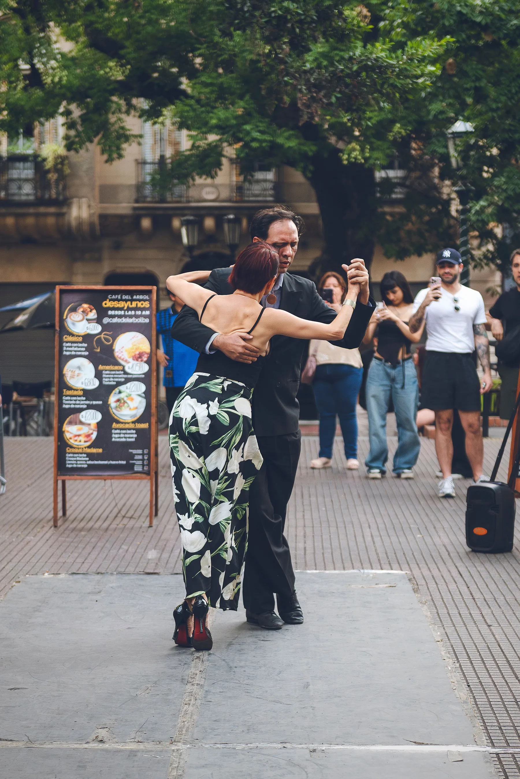 A tango couple performing in a Buenos Aires plaza