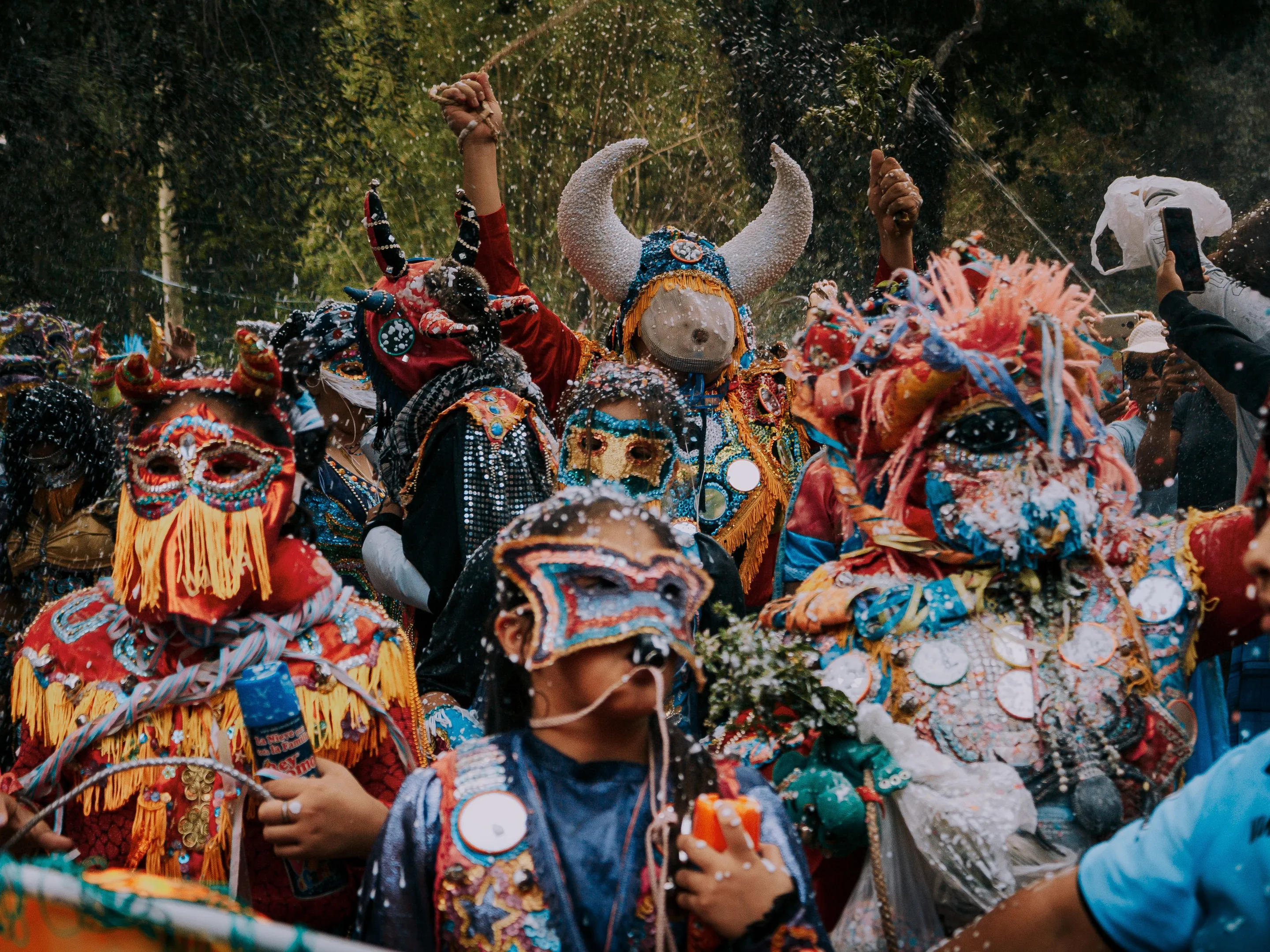 People wearing colourful masks and costumes during a celebration in Jujuy