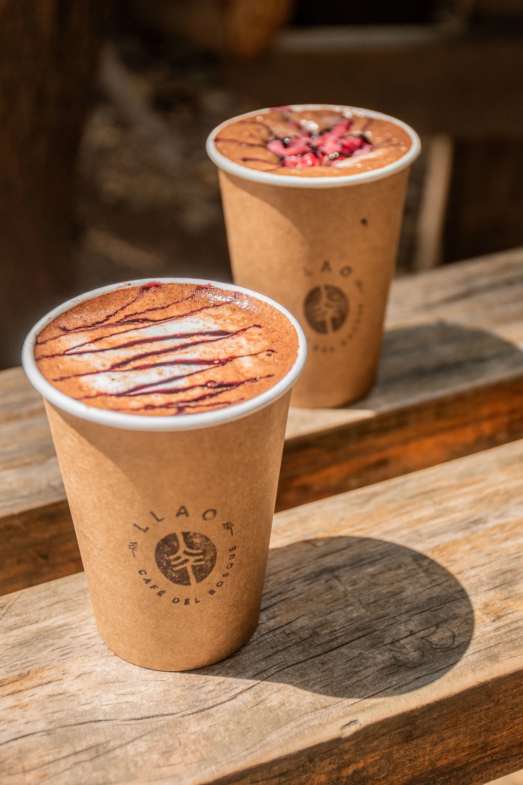 Cups of hot chocolate on a rustic bench in Bariloche