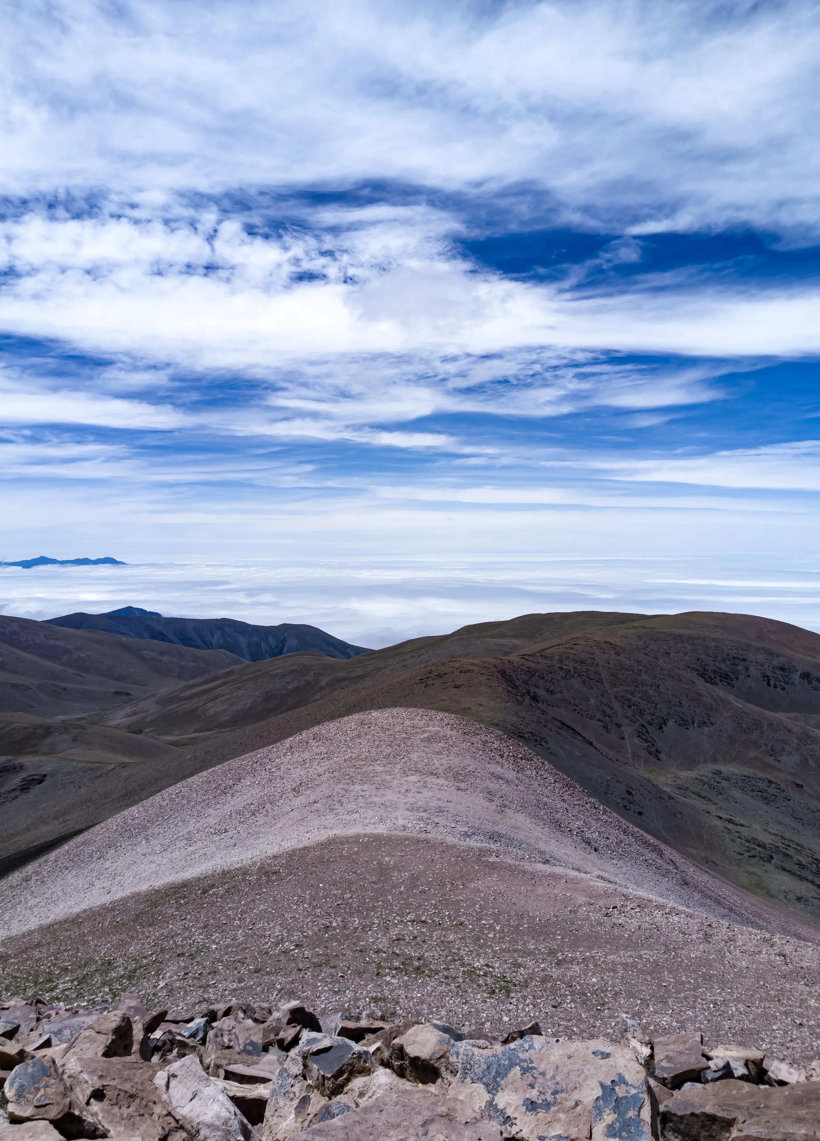 Mountain ridges beneath dramatic cloud in Jujuy Province.