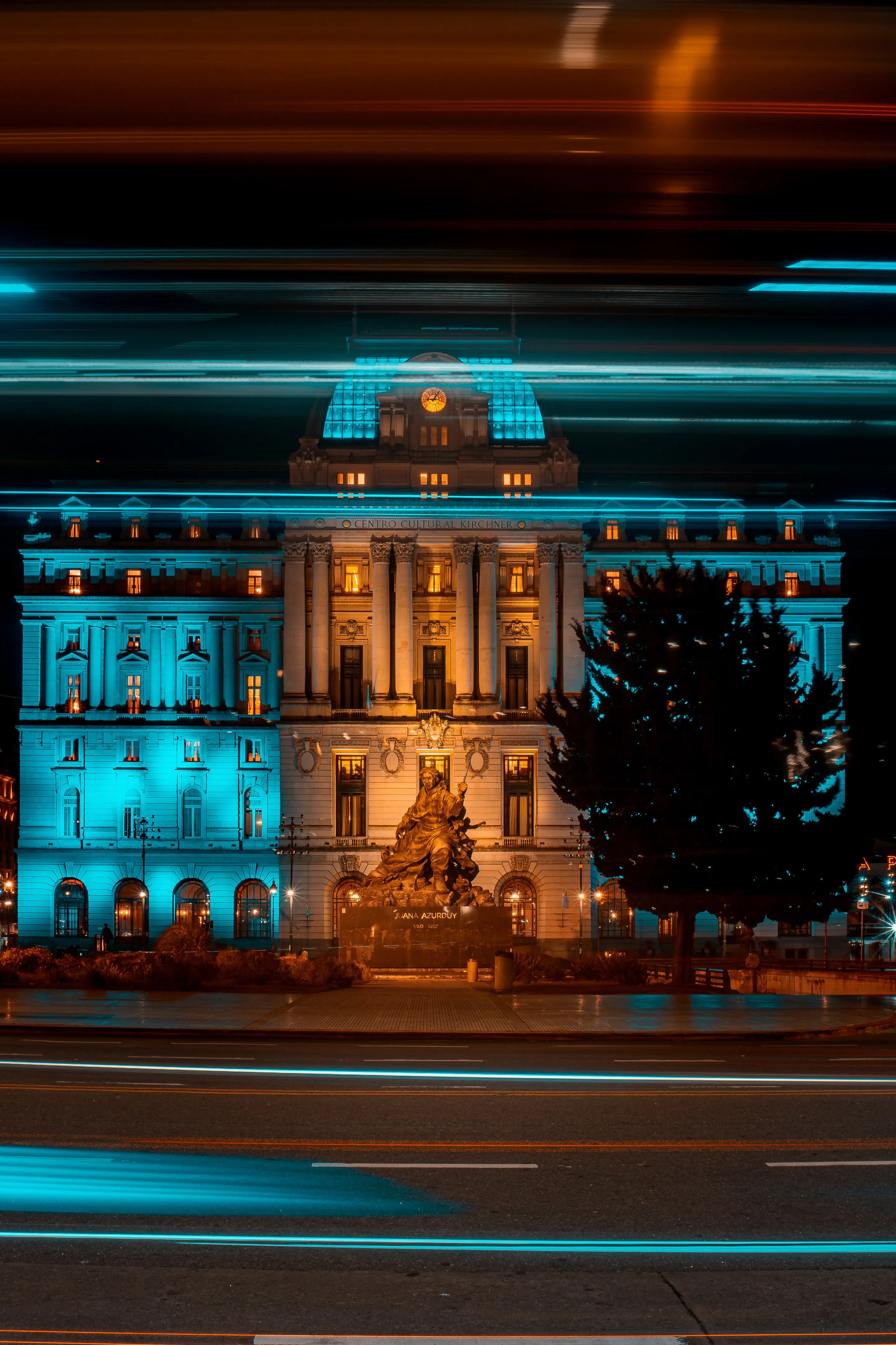 An illuminated neoclassical building and light trails in Buenos Aires.