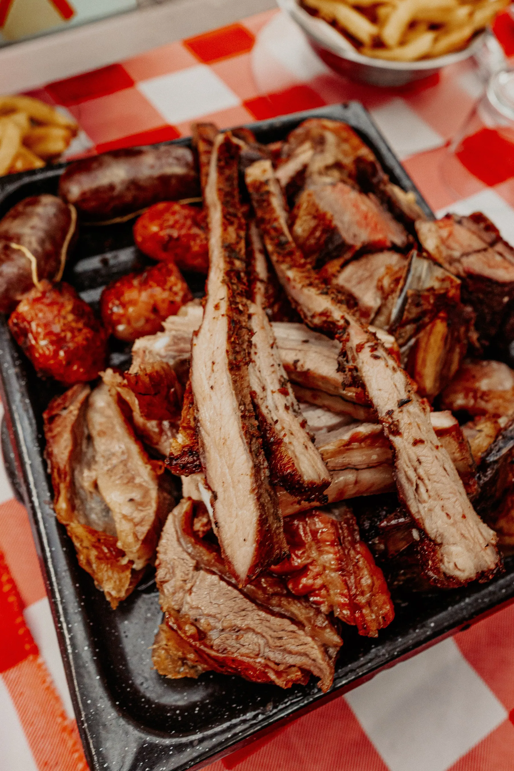 A close view of a selection of Argentine grilled meats and sausages