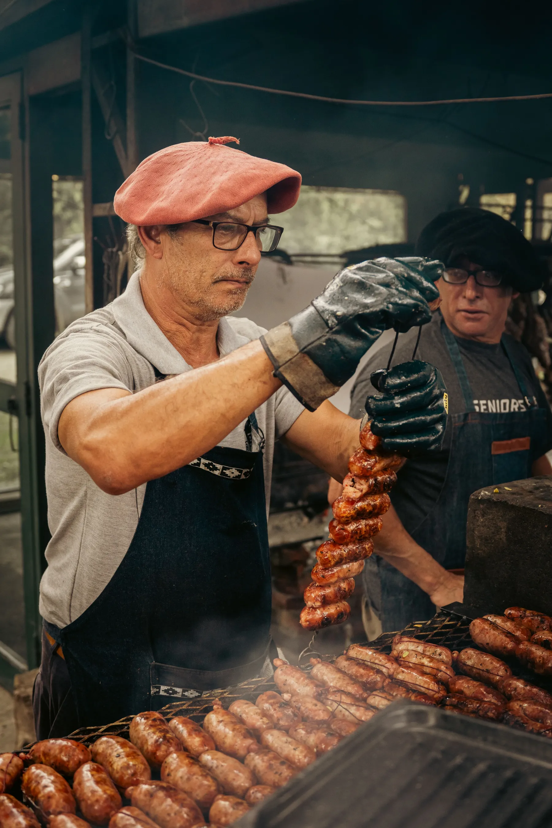 Cooks tending an outdoor asado in Uribelarrea