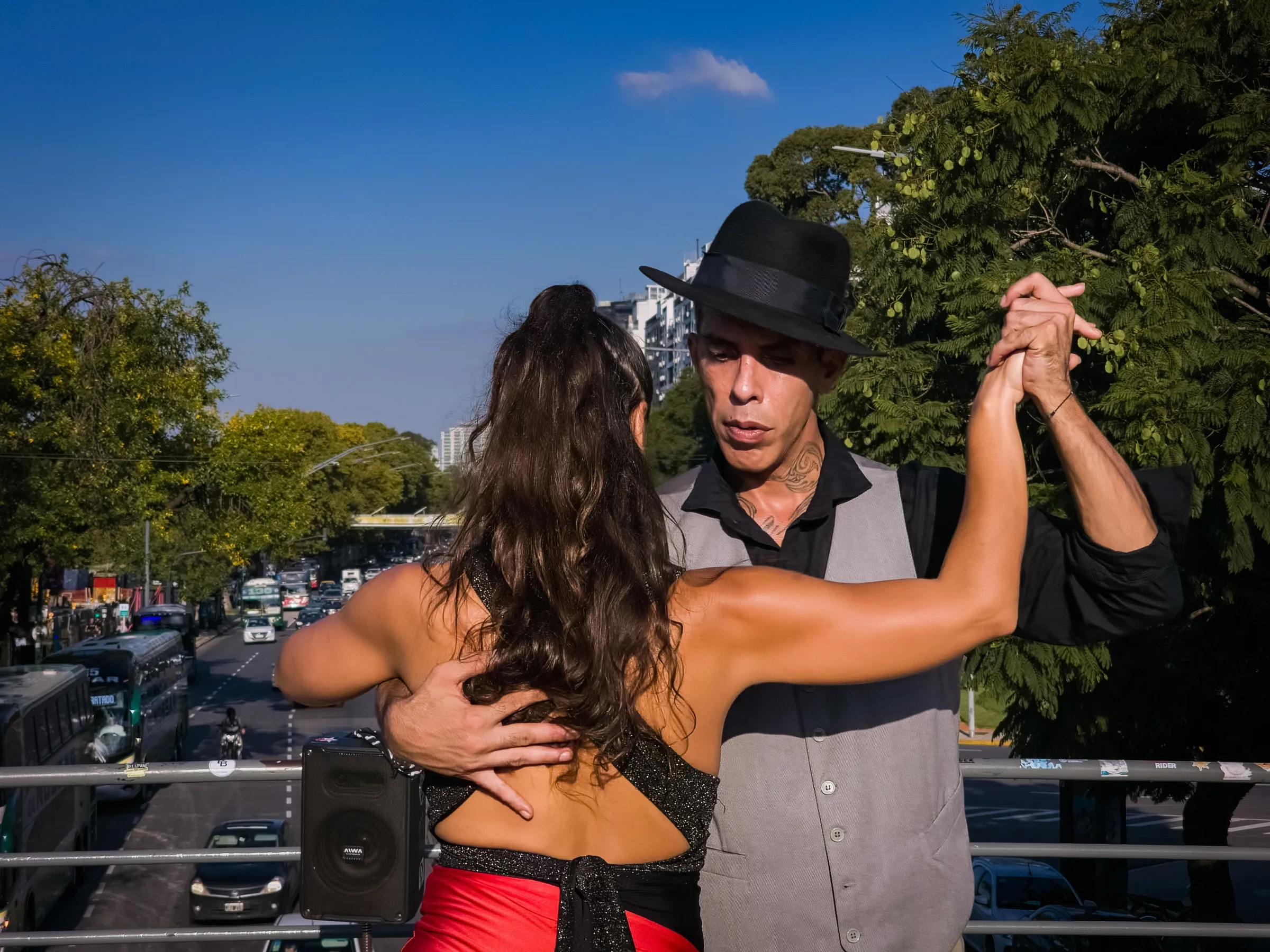 A couple performing tango on a Buenos Aires street.