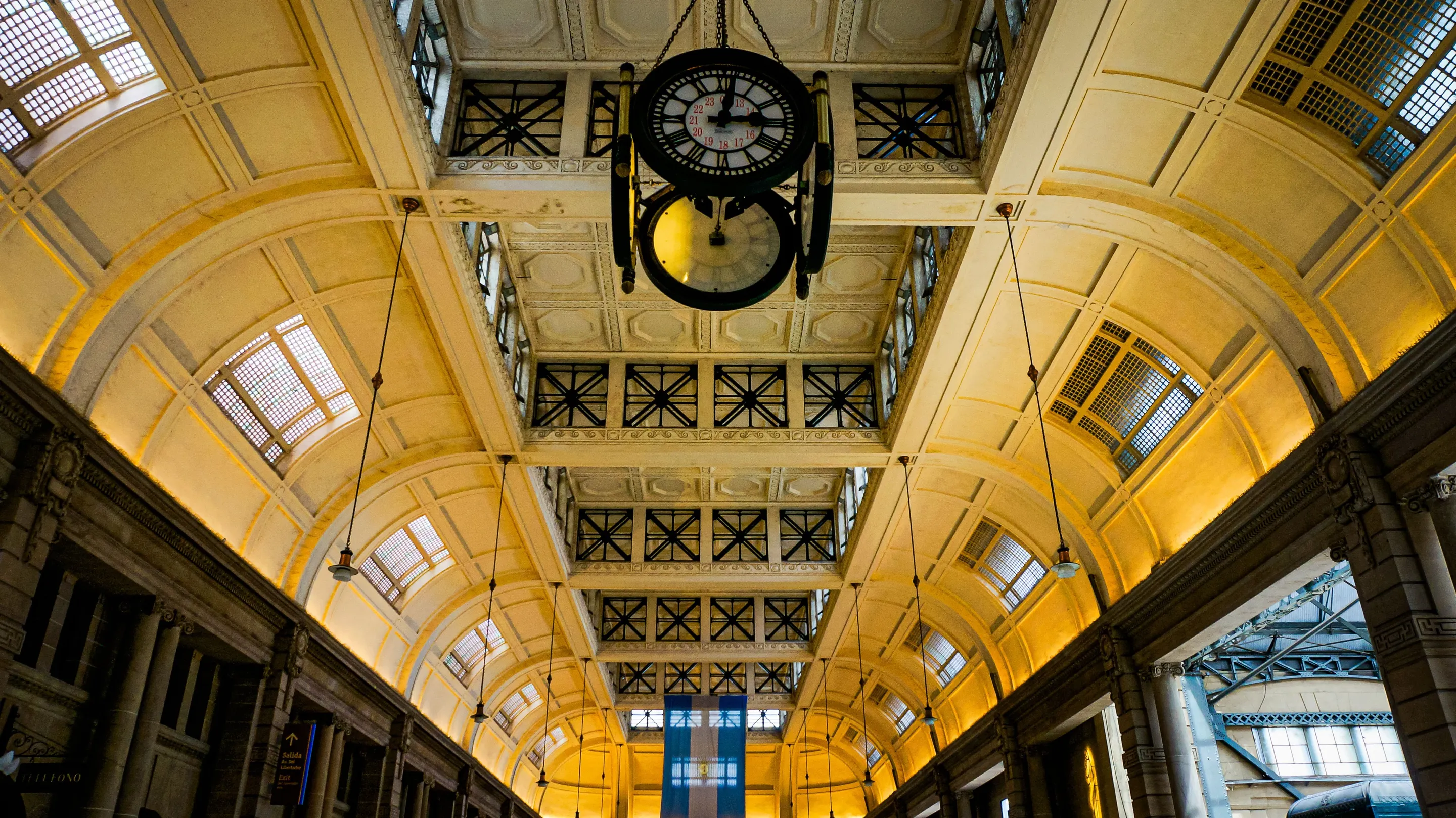 An ornate railway-station ceiling and clock in Buenos Aires.