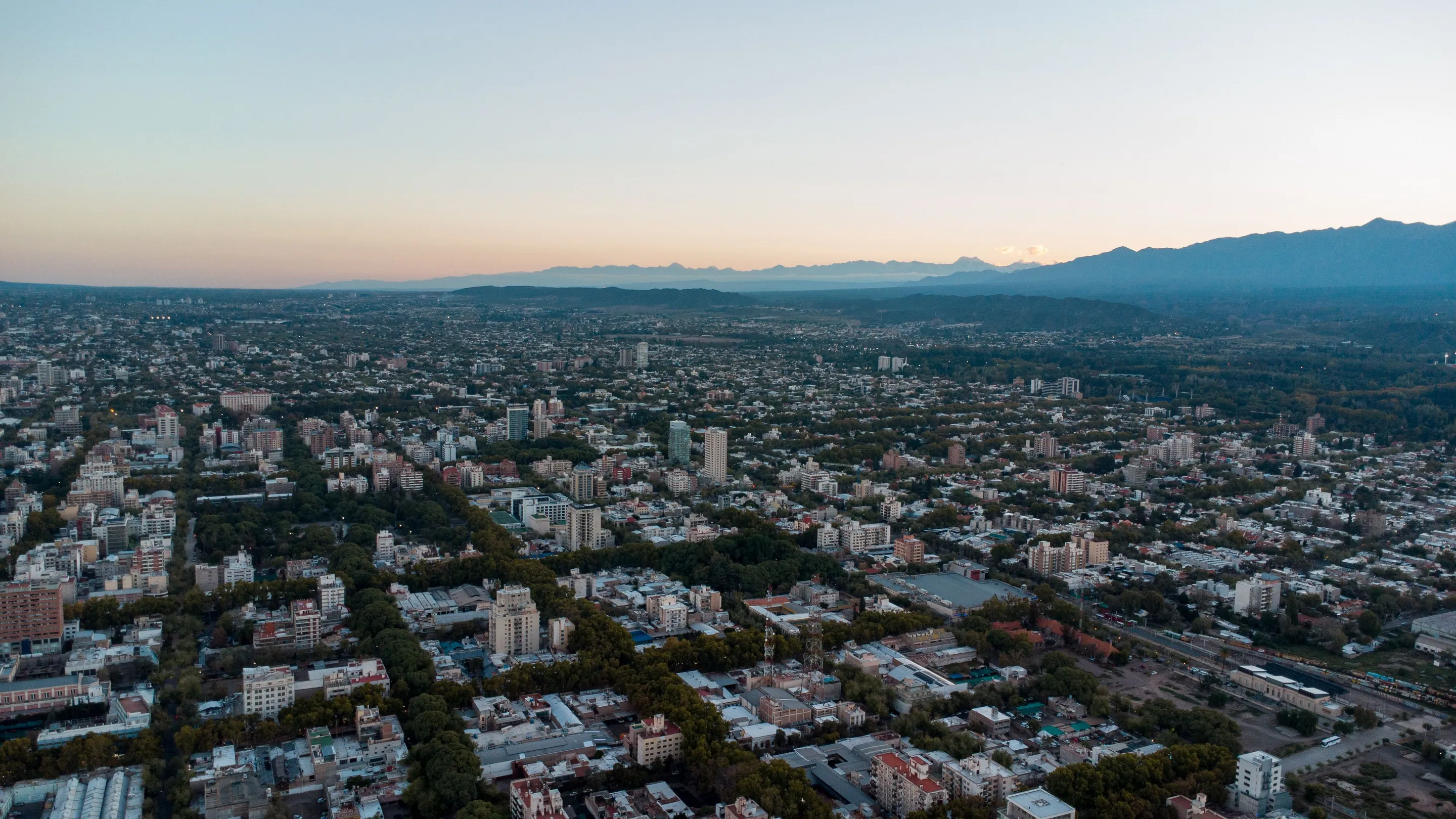 Mendoza's urban landscape and distant mountains in evening light