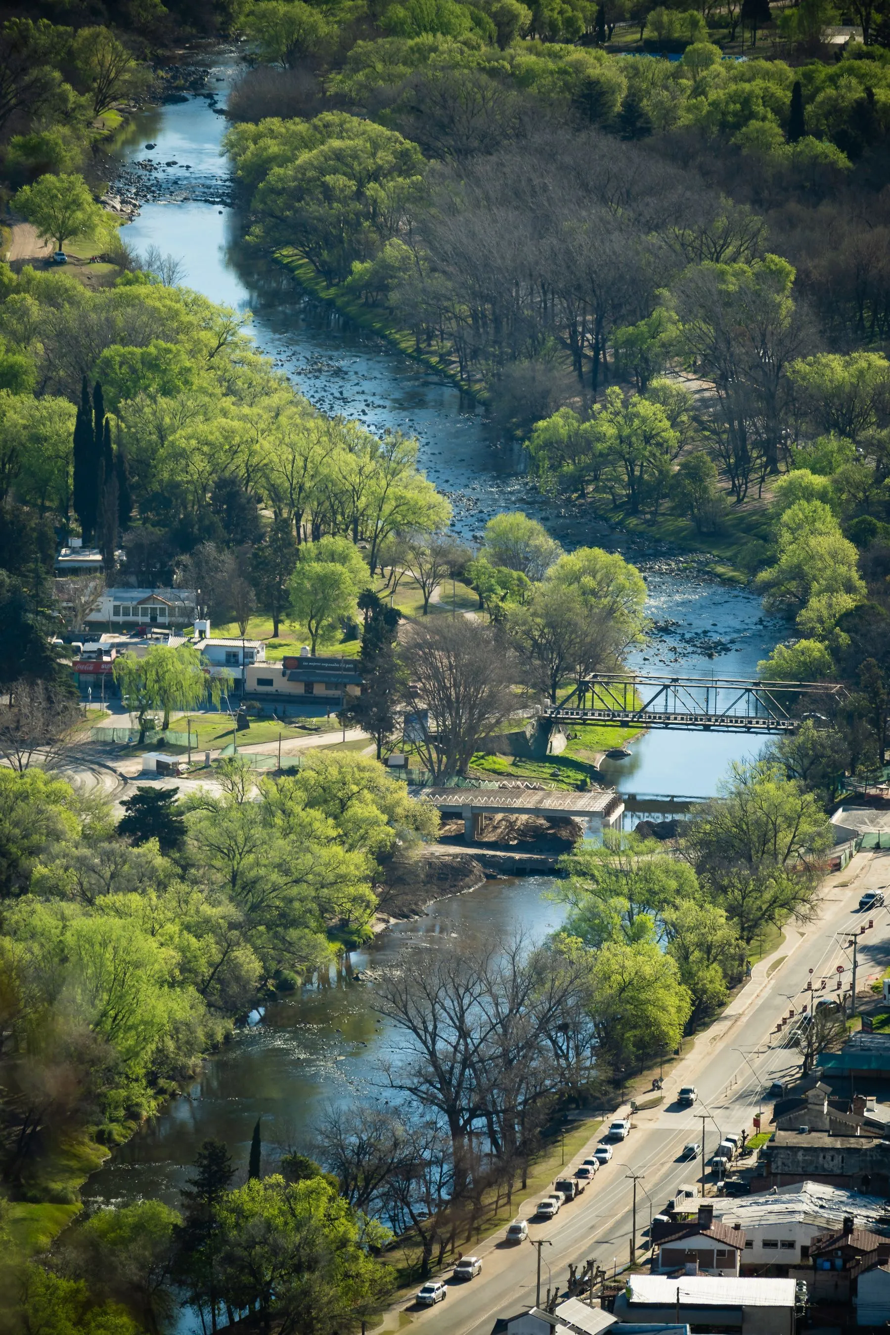 The Santa Rosa River winding through trees and town