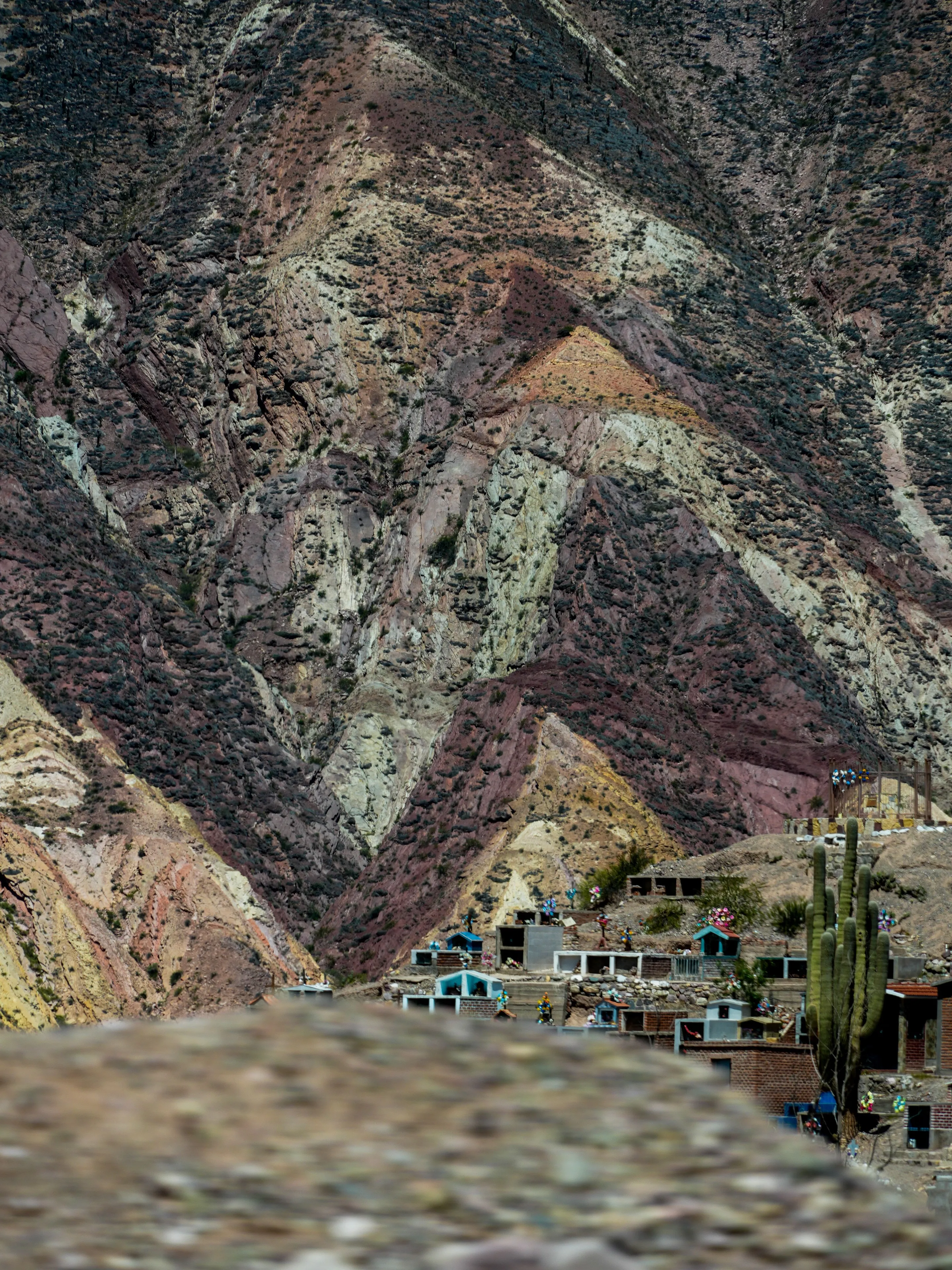Purmamarca beneath the layered multicoloured hills of Jujuy