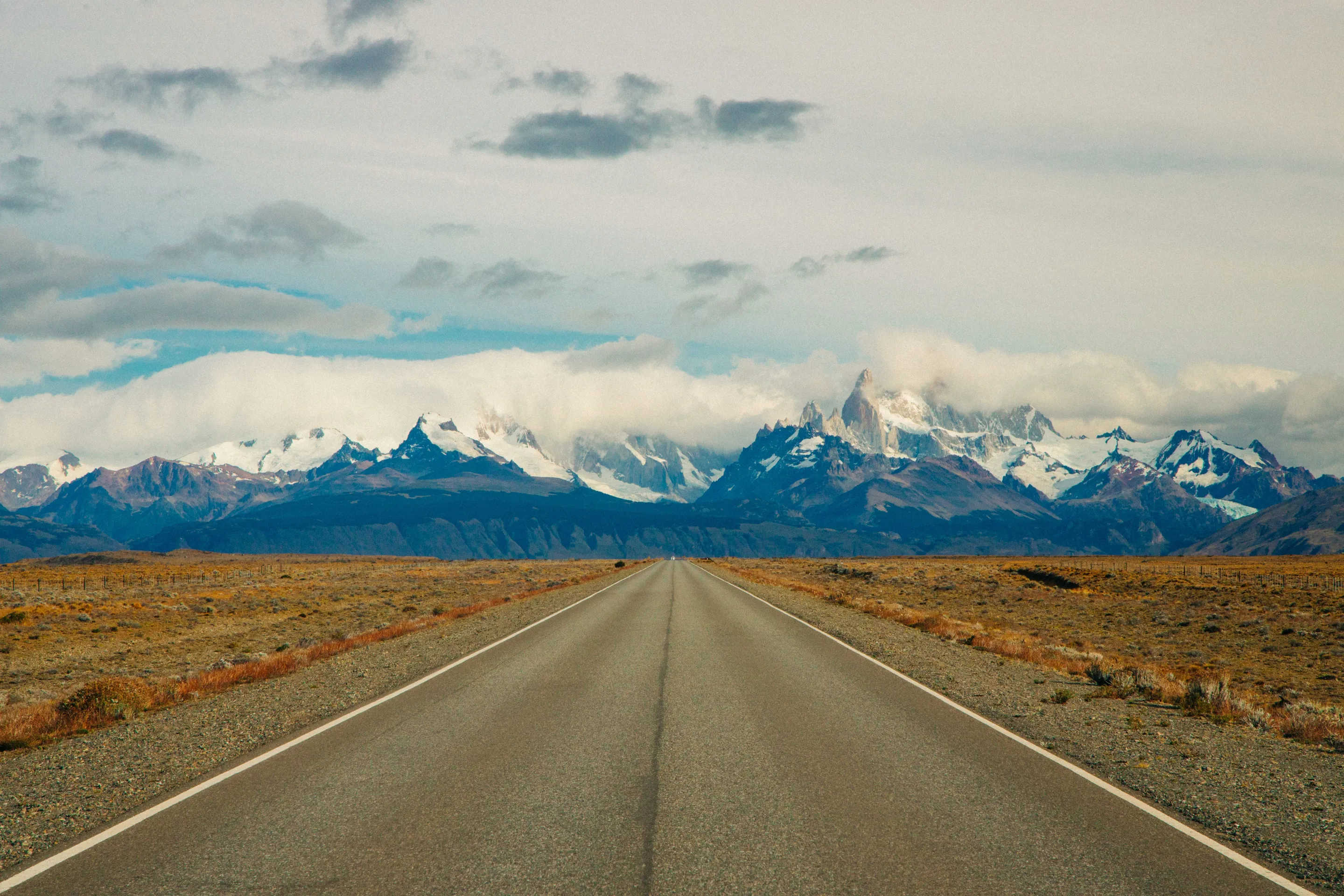 A road across the open country towards the Fitz Roy mountains