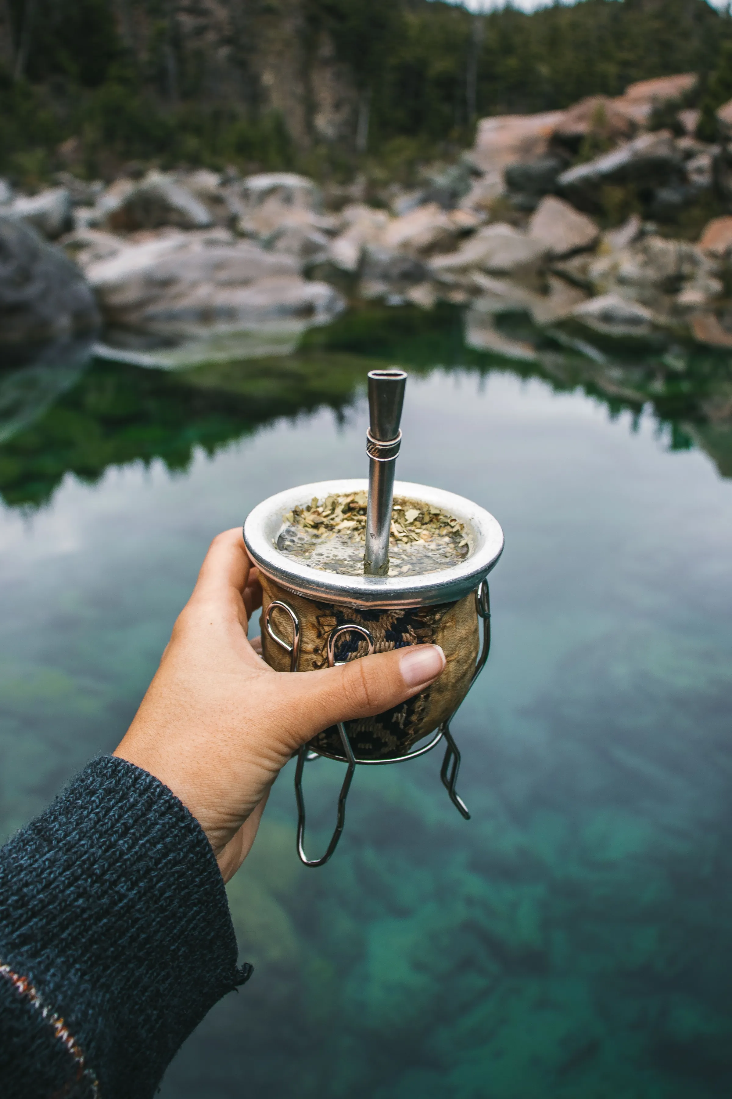 A mate held close beside a lake in Chubut Province.