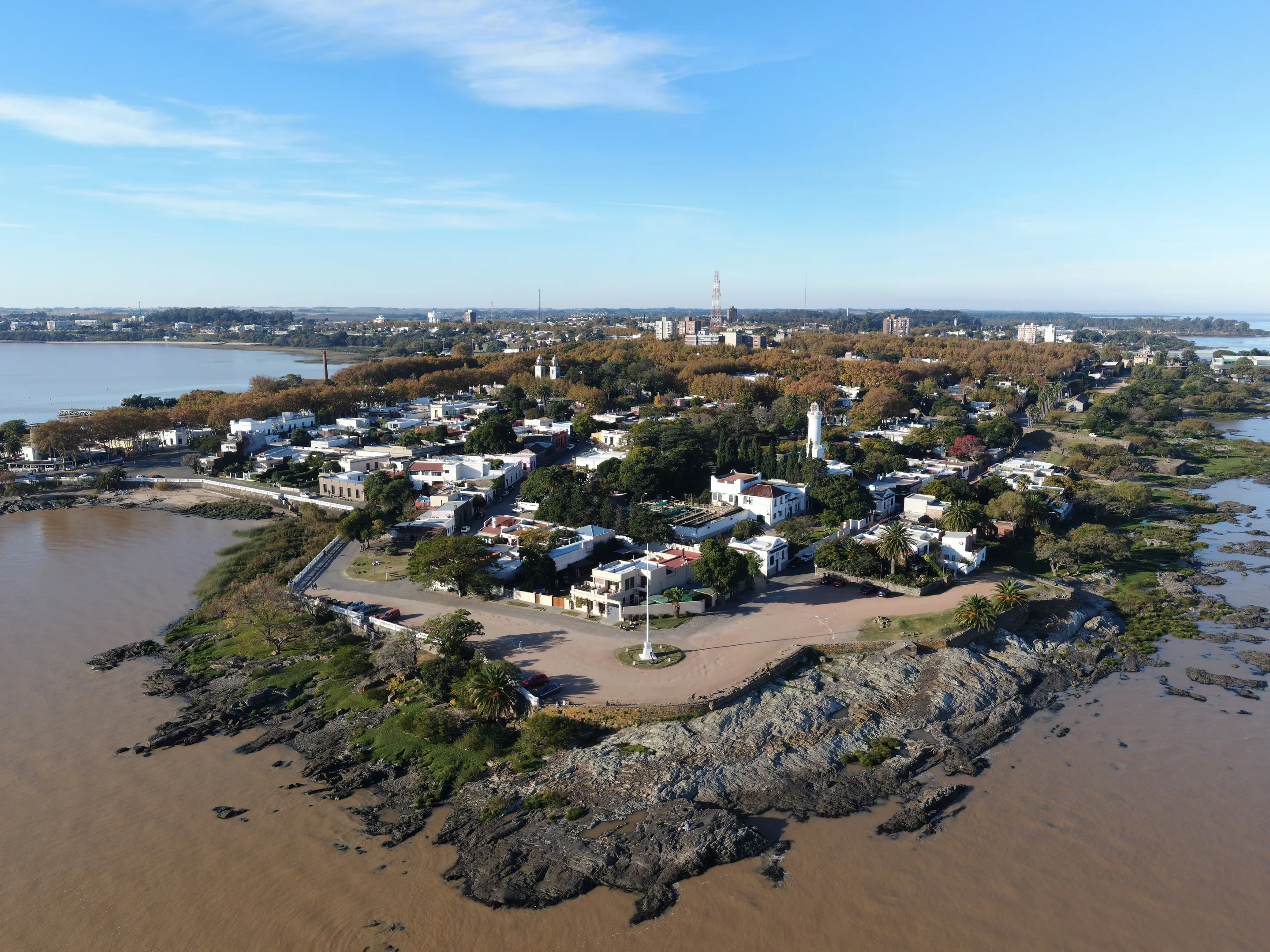 Colonia del Sacramento's historic buildings and trees beside the Río de la Plata