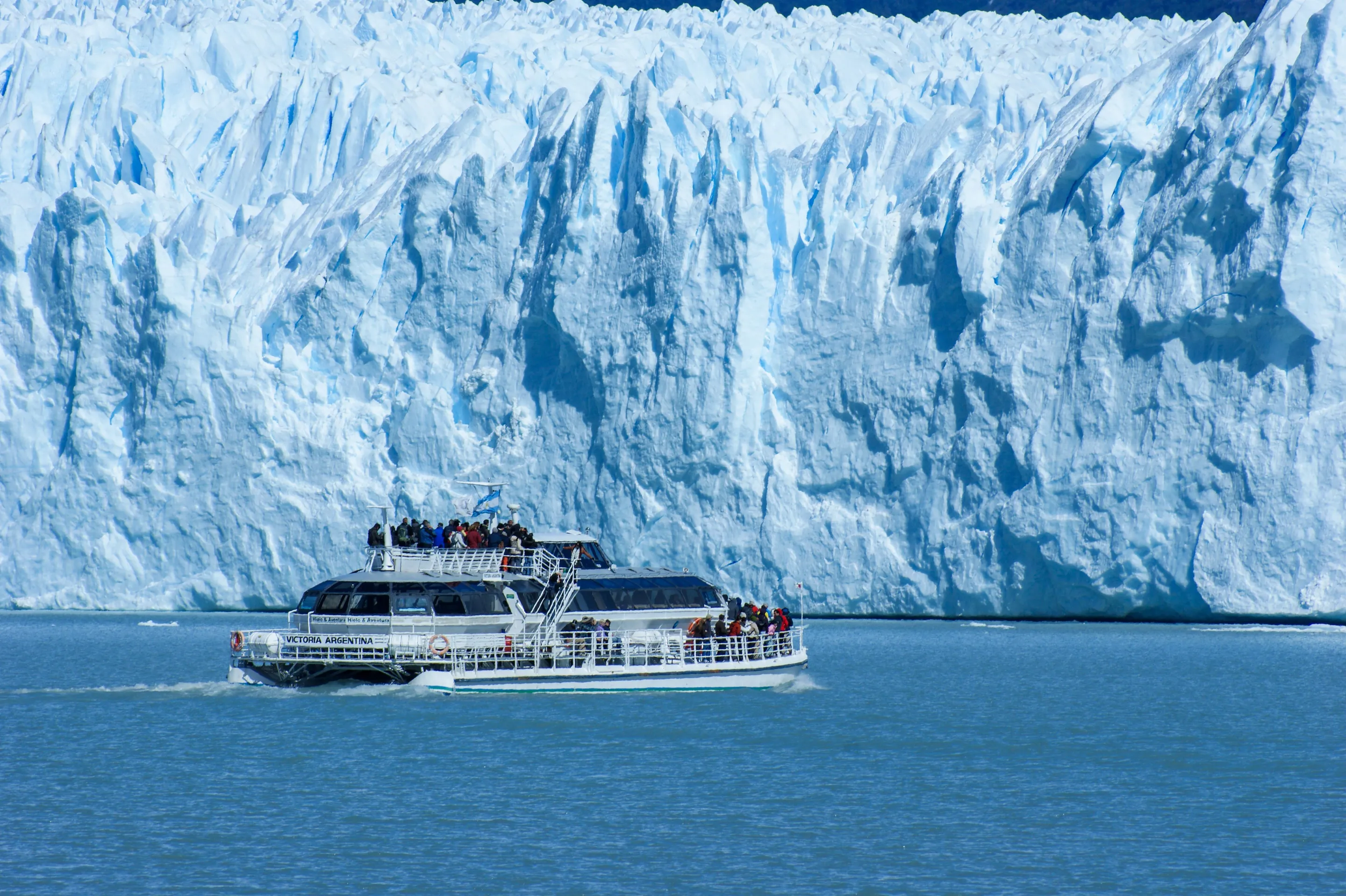 Passengers on a boat near Perito Moreno Glacier.