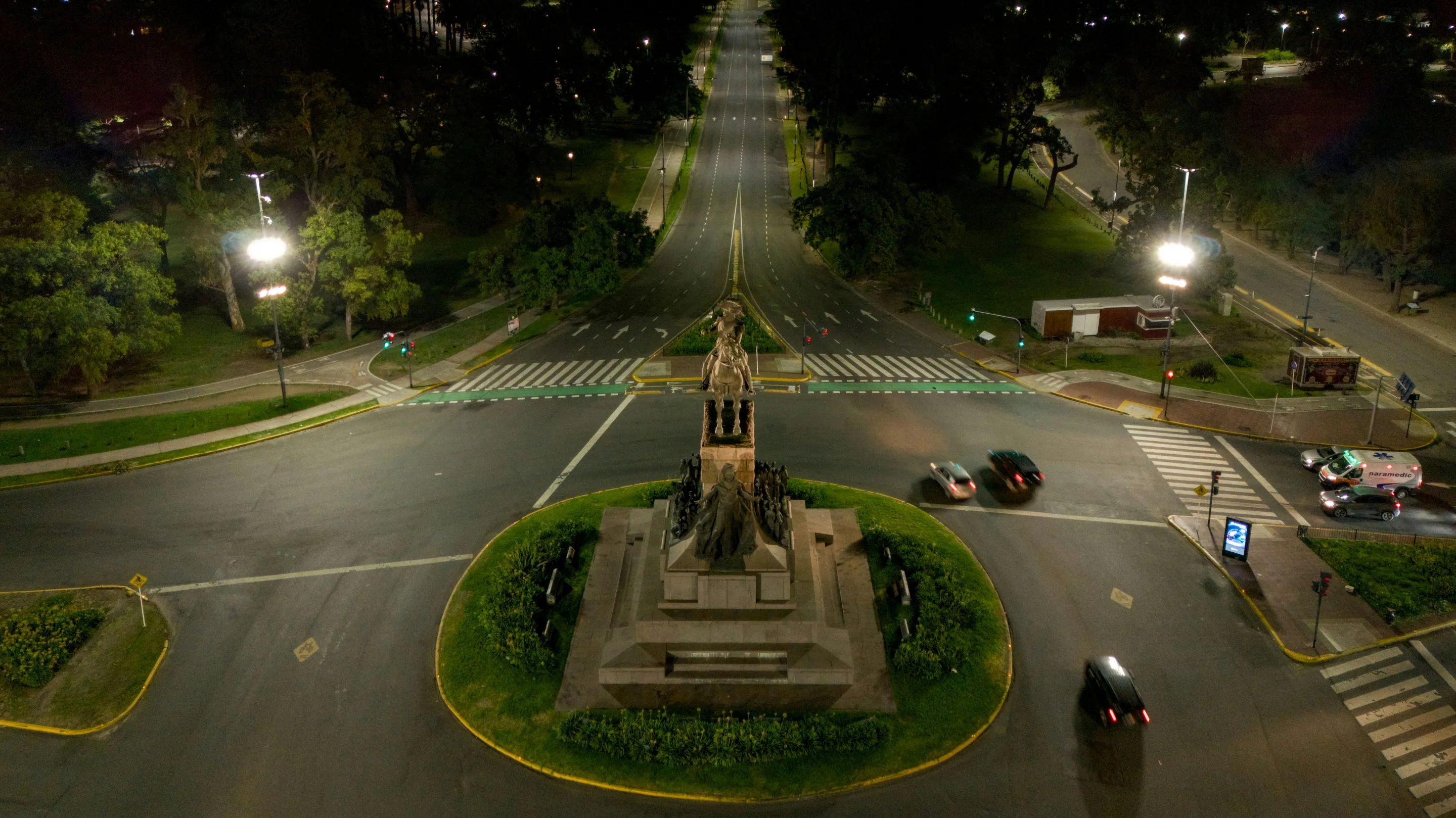 Aerial view of illuminated avenues and parkland in Palermo after dark