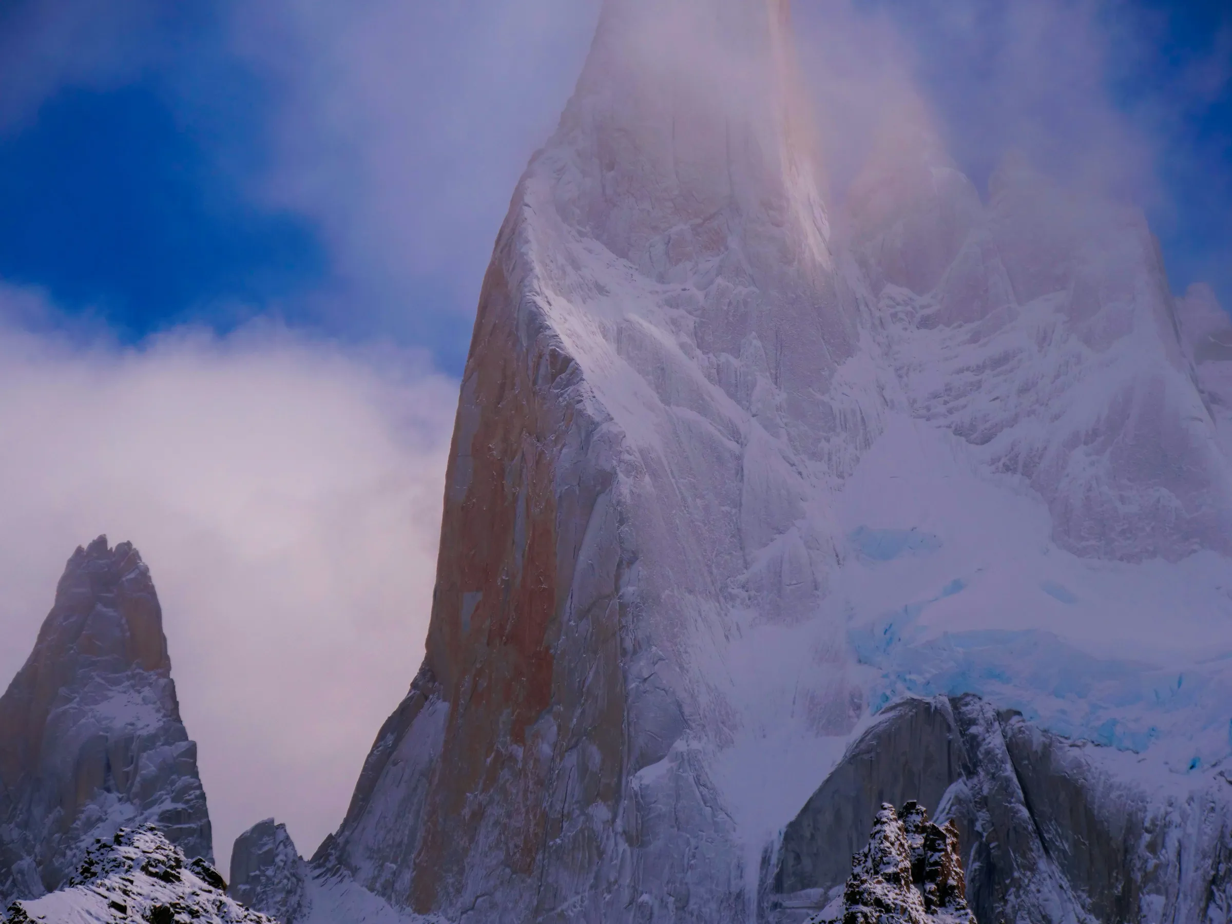 A close view of snow and granite rising above Laguna de los Tres