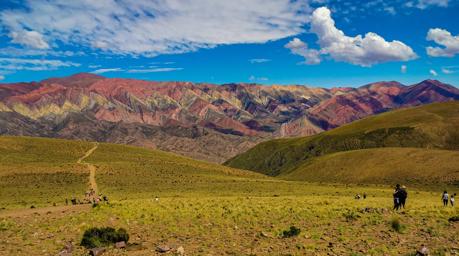 Visitors looking across Hornocal's layered mountain landscape
