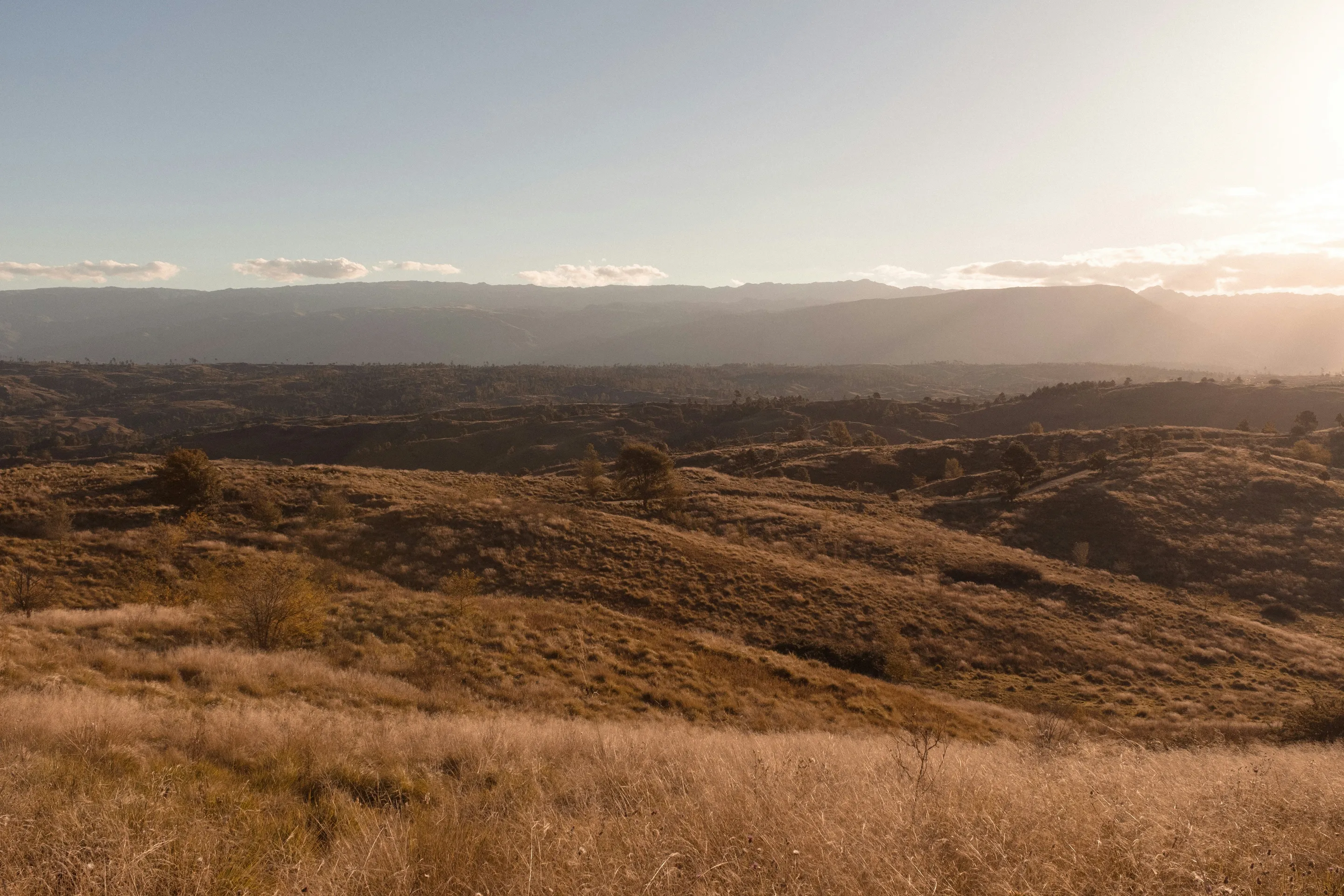 Sunlight across grasses and mountains in Calamuchita