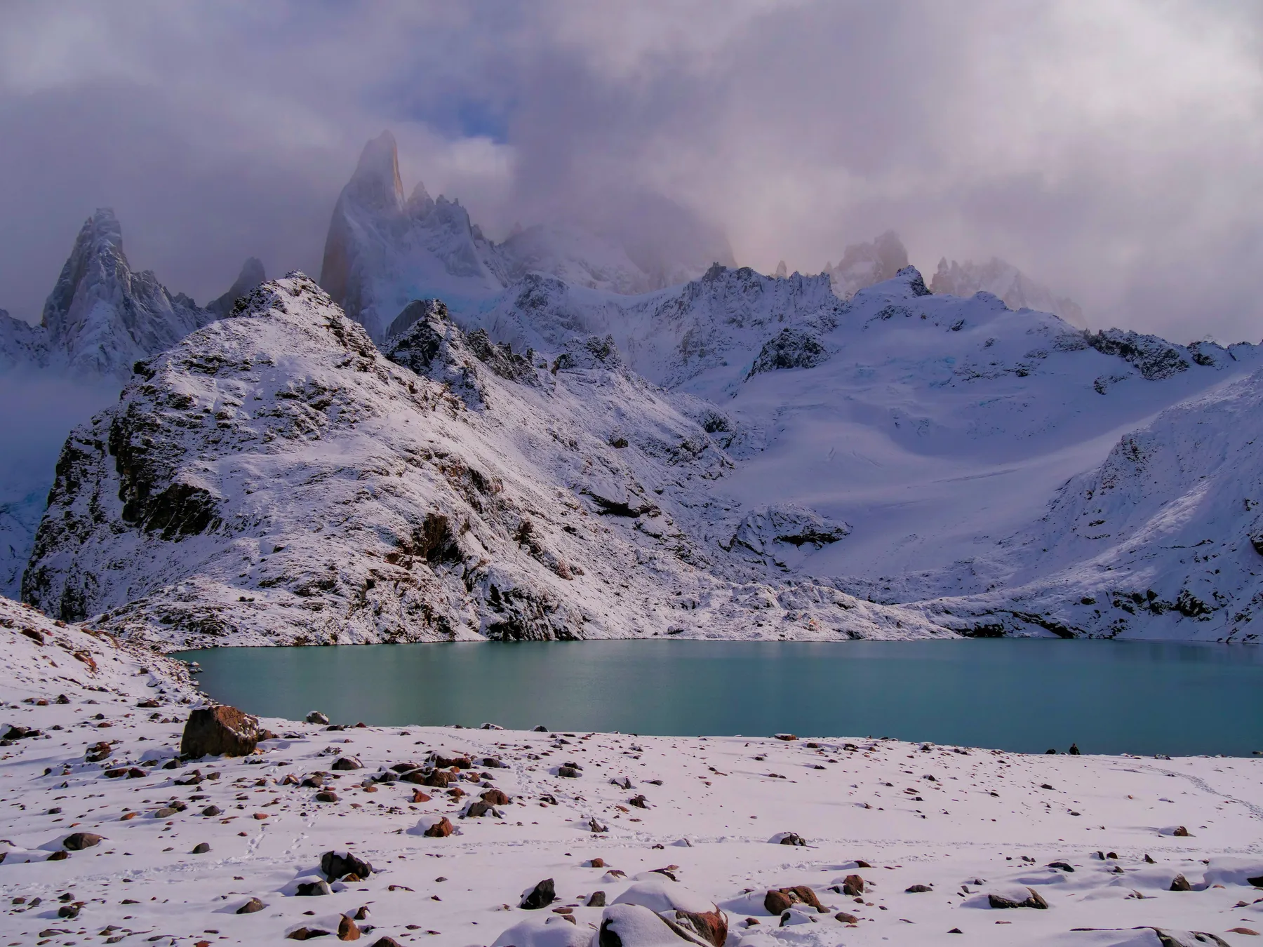 Snow-covered mountains above the high lake at Laguna de los Tres
