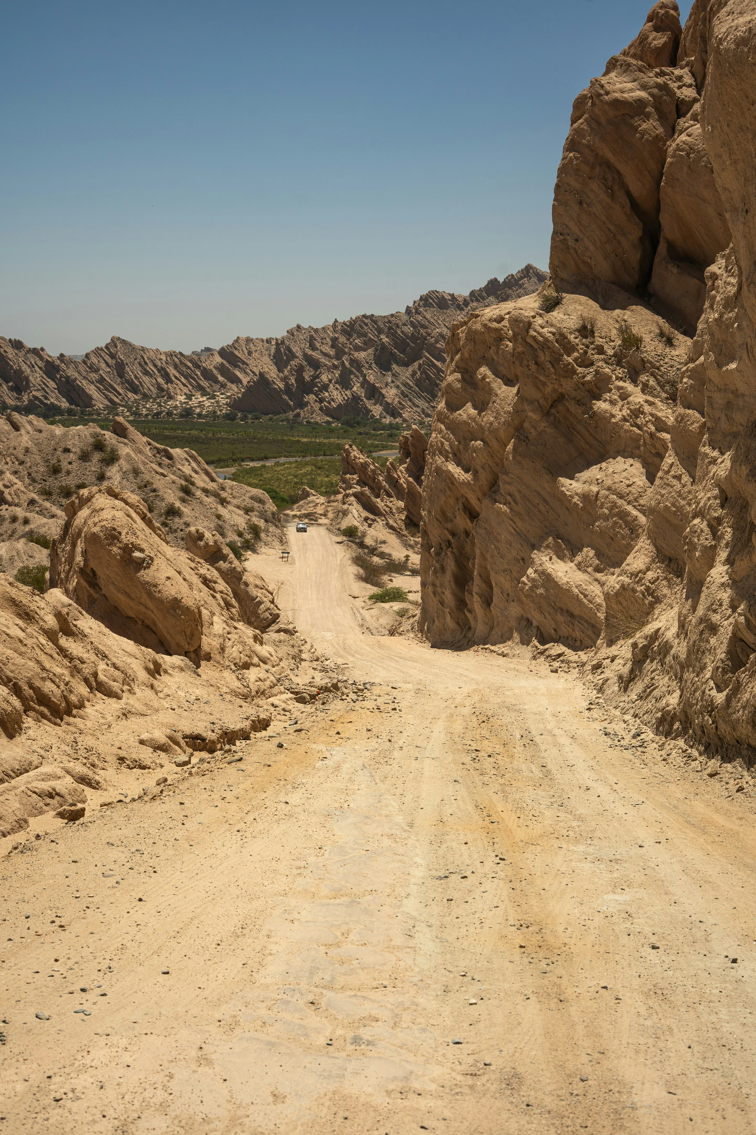 A dirt road crossing the rocky valleys near Cafayate.