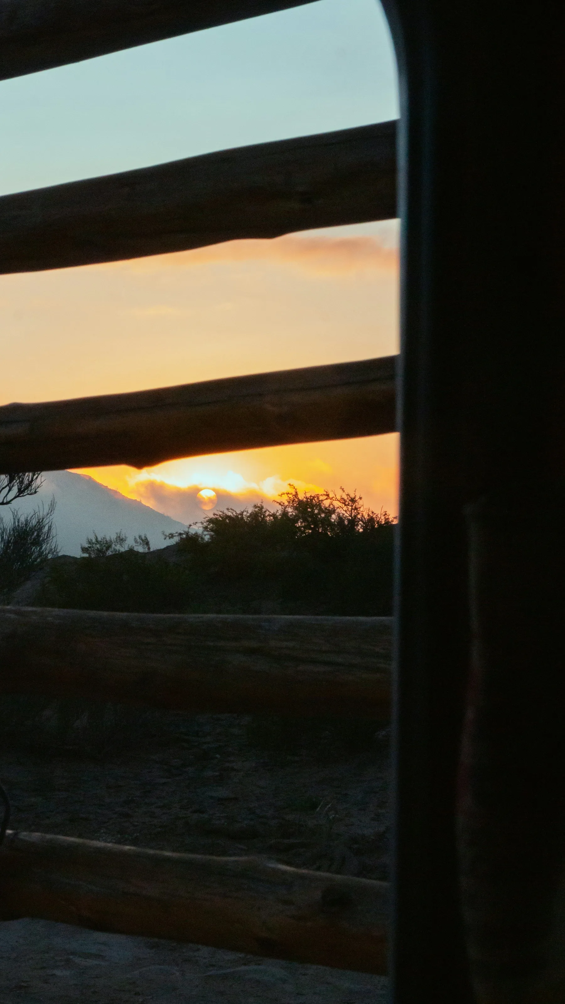 Low sunlight across San Juan desert country seen through a window