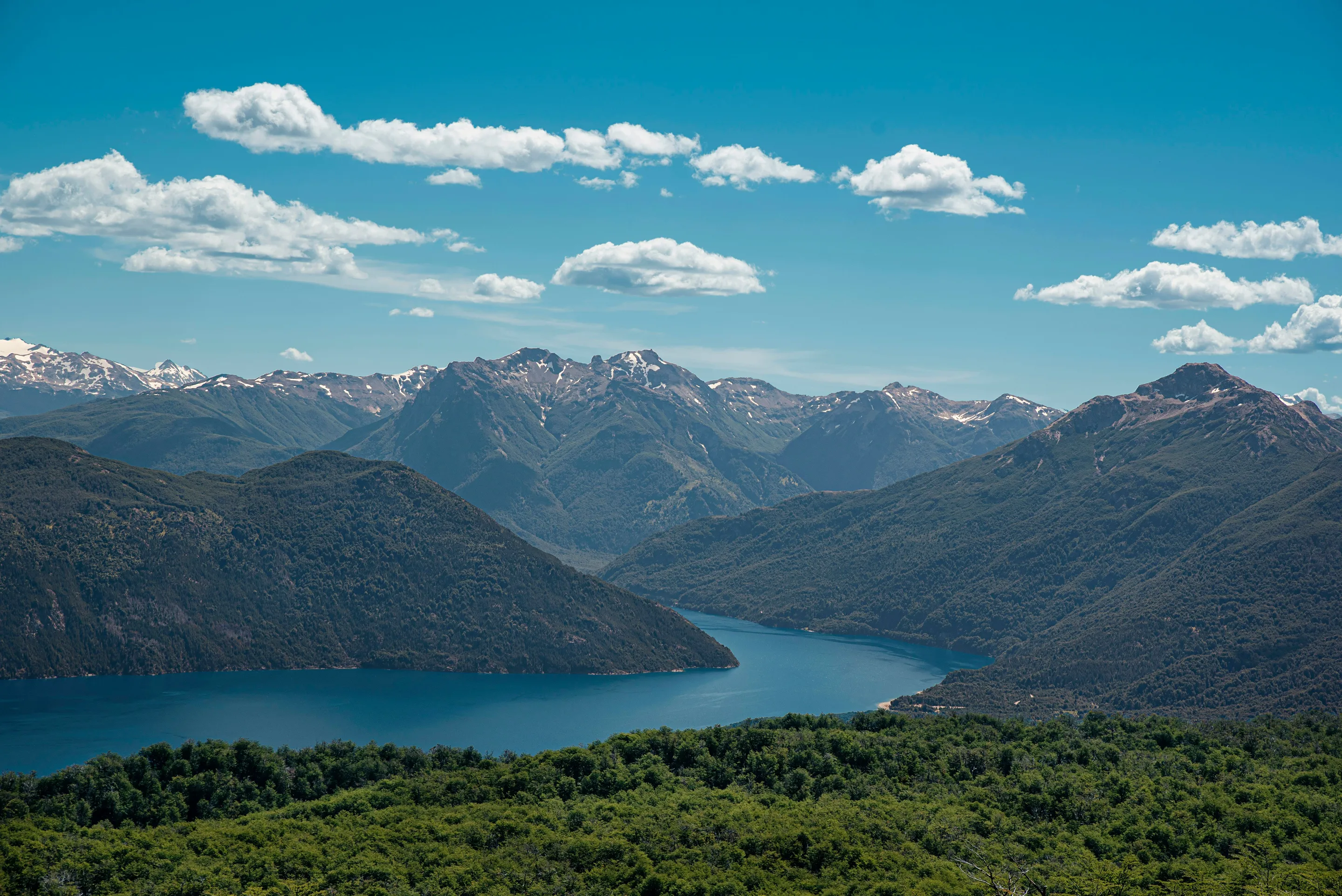 A lake held between forested mountains in Los Alerces National Park