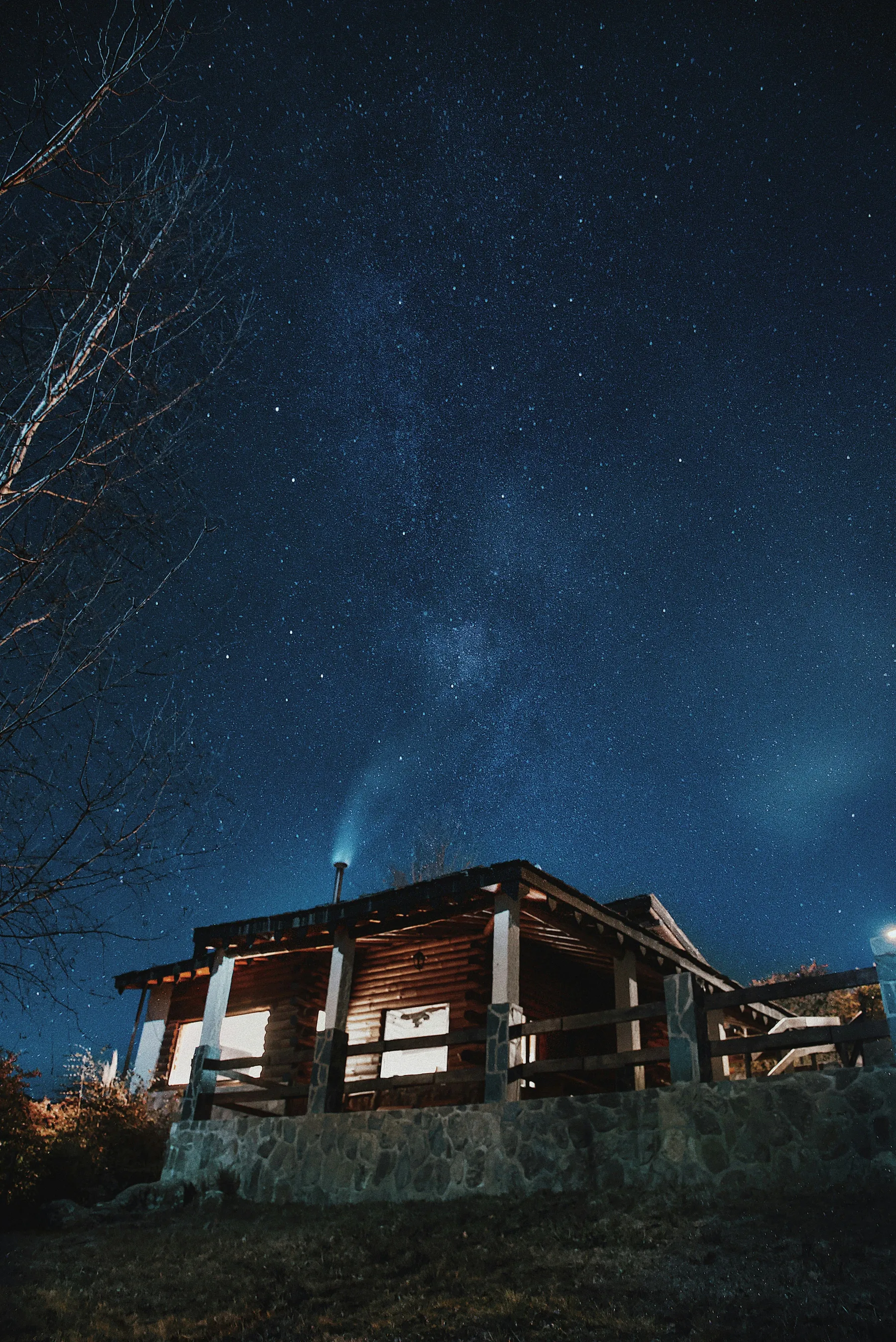 An illuminated house beneath the night sky in La Cumbrecita