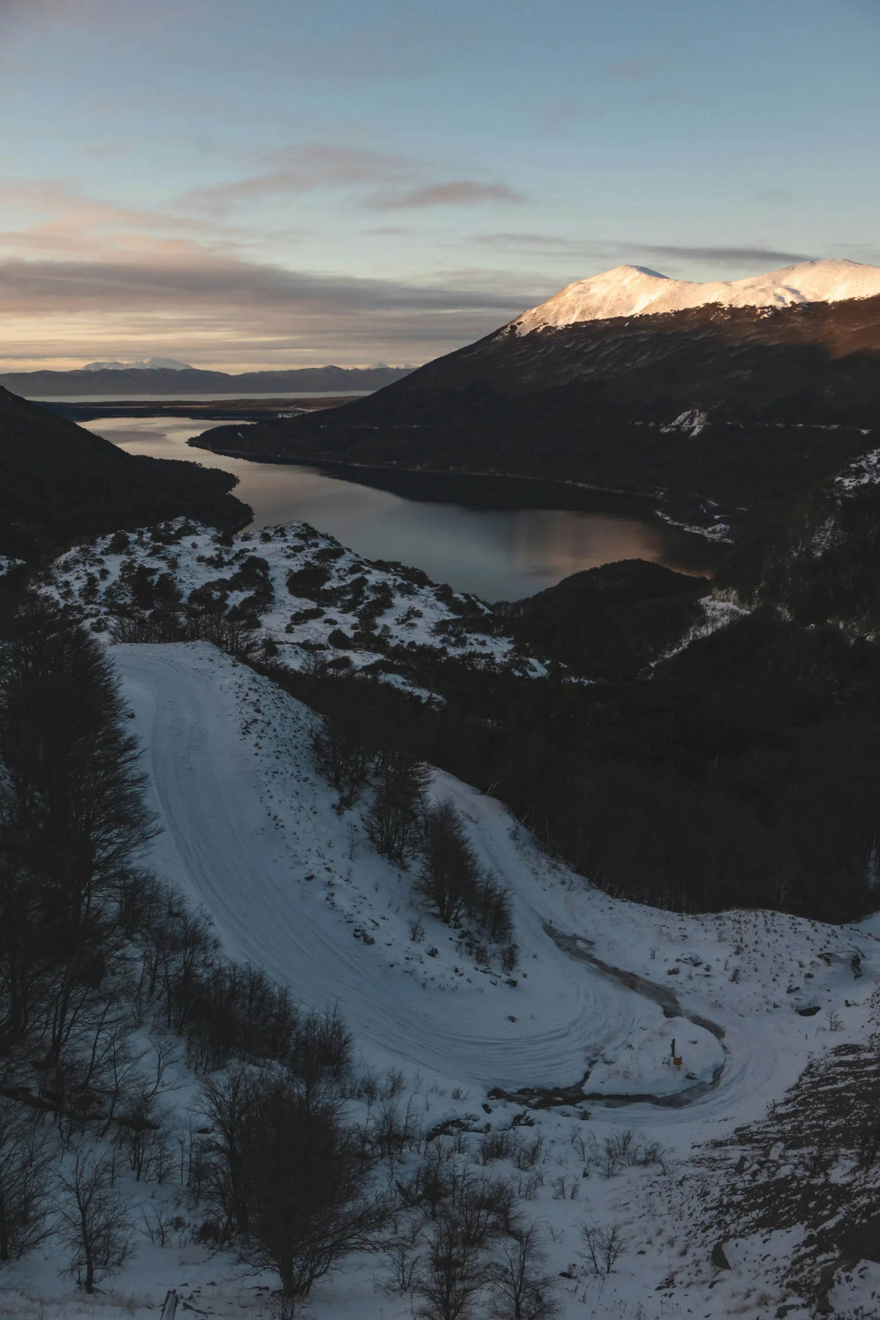 A snowy landscape around Lago Escondido viewed from the mountain road